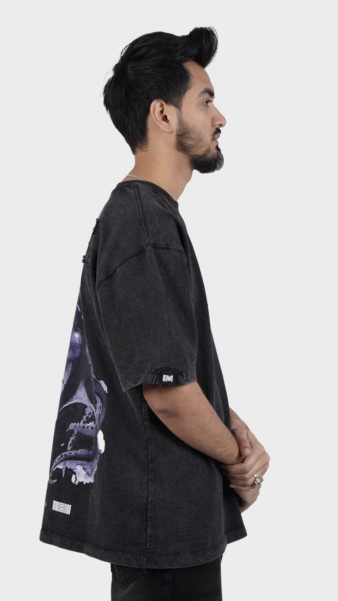 Heavyweight cotton streetwear t-shirt. Side profile of Incroy Merv Agile t-shirt showing loose dropped shoulder fit.