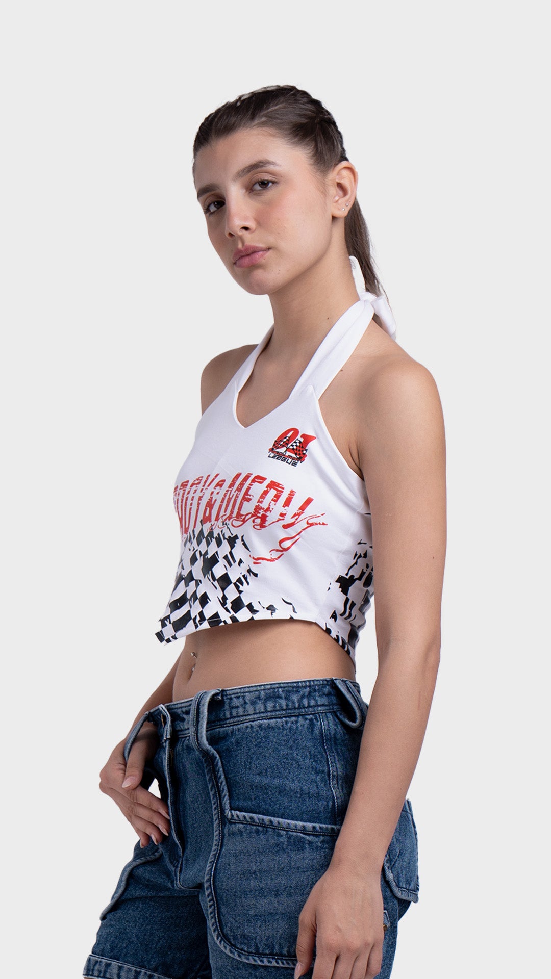 Side view of a women's white halter neck crop top with a pointed asymmetrical handkerchief hemline