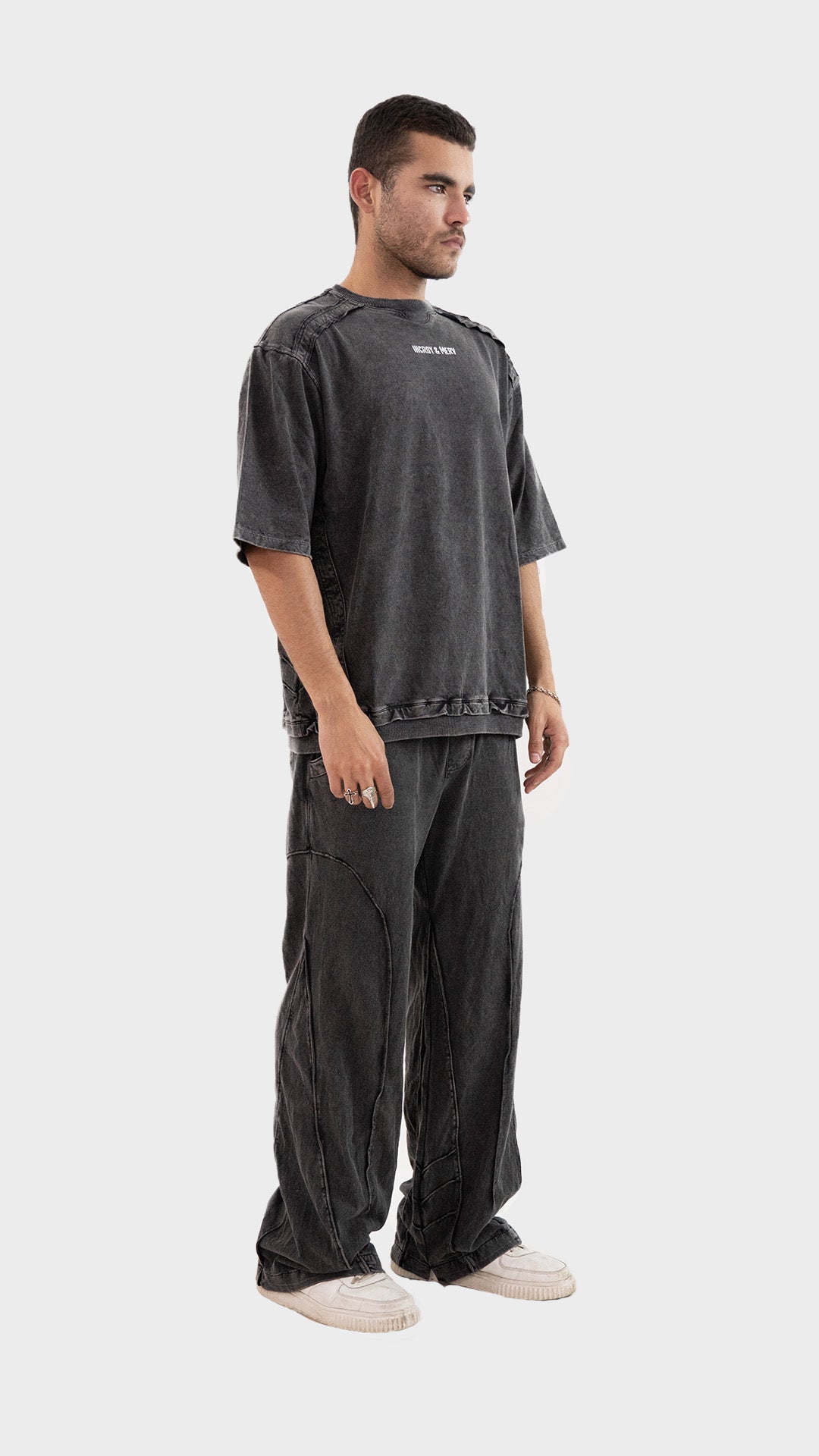 Side profile view of the Incroy and Merv Beyond Co-Ord Set in Charcoal highlighting the relaxed streetwear fit.