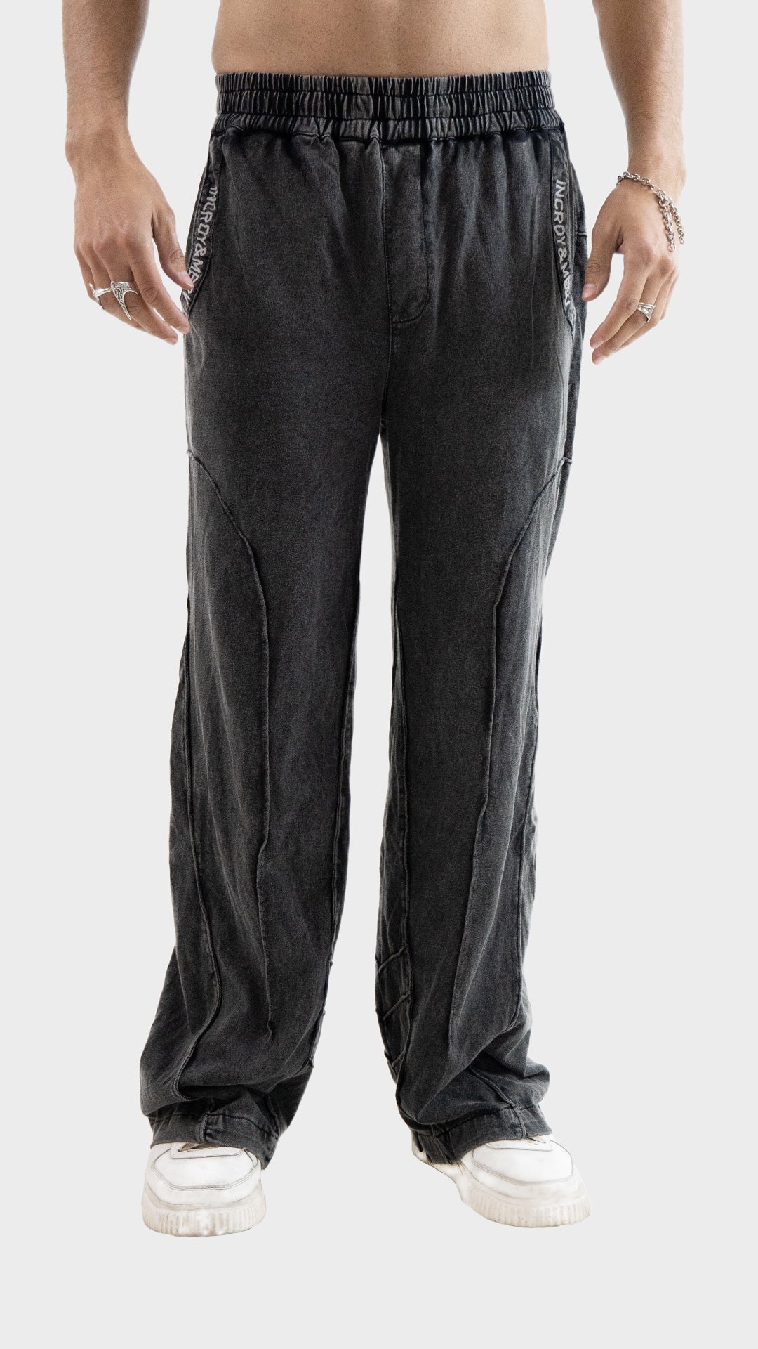 Front close-up view of Incroy & Merv men's Beyond Trouser in charcoal cotton sinker fabric with raw seam details.
