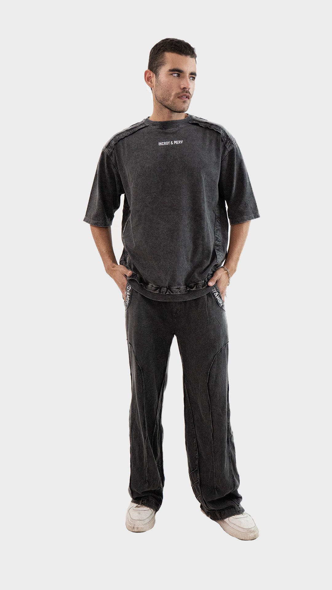 Full length front view of a male model wearing Incroy & Merv men's charcoal Beyond Trouser in cotton sinker fabric.