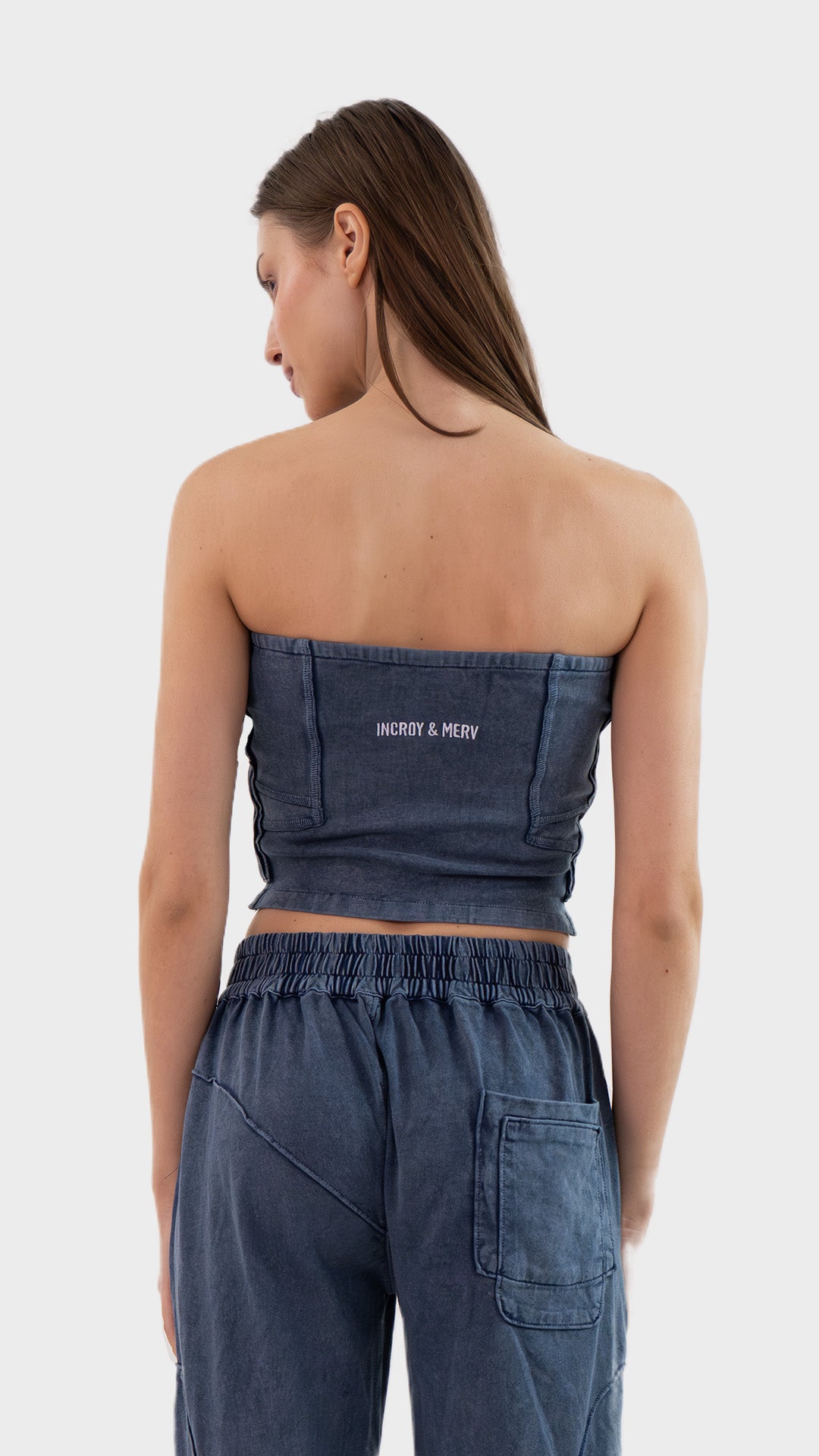 Back view of Incroy & Merv women's Beyond Tube Top in dusky blue ribbed fabric showing rear seam structure.
