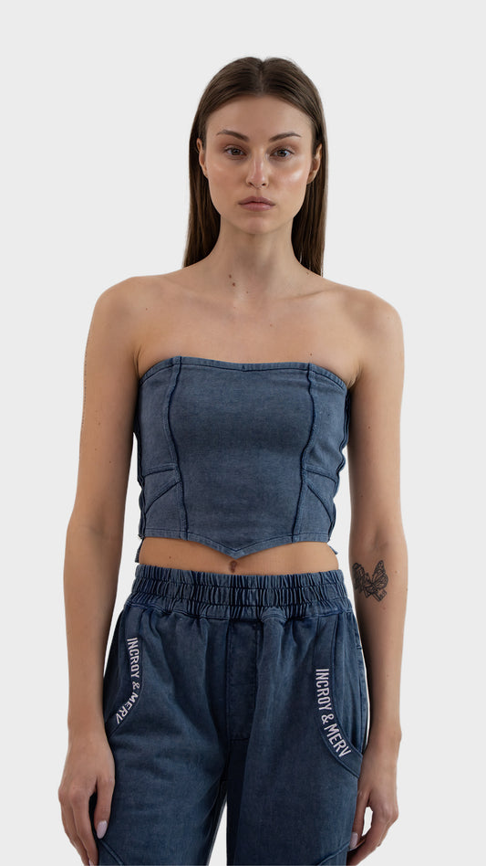 Front view of Incroy & Merv women's Beyond Tube Top in dusky blue ribbed fabric with corset style seam lines.