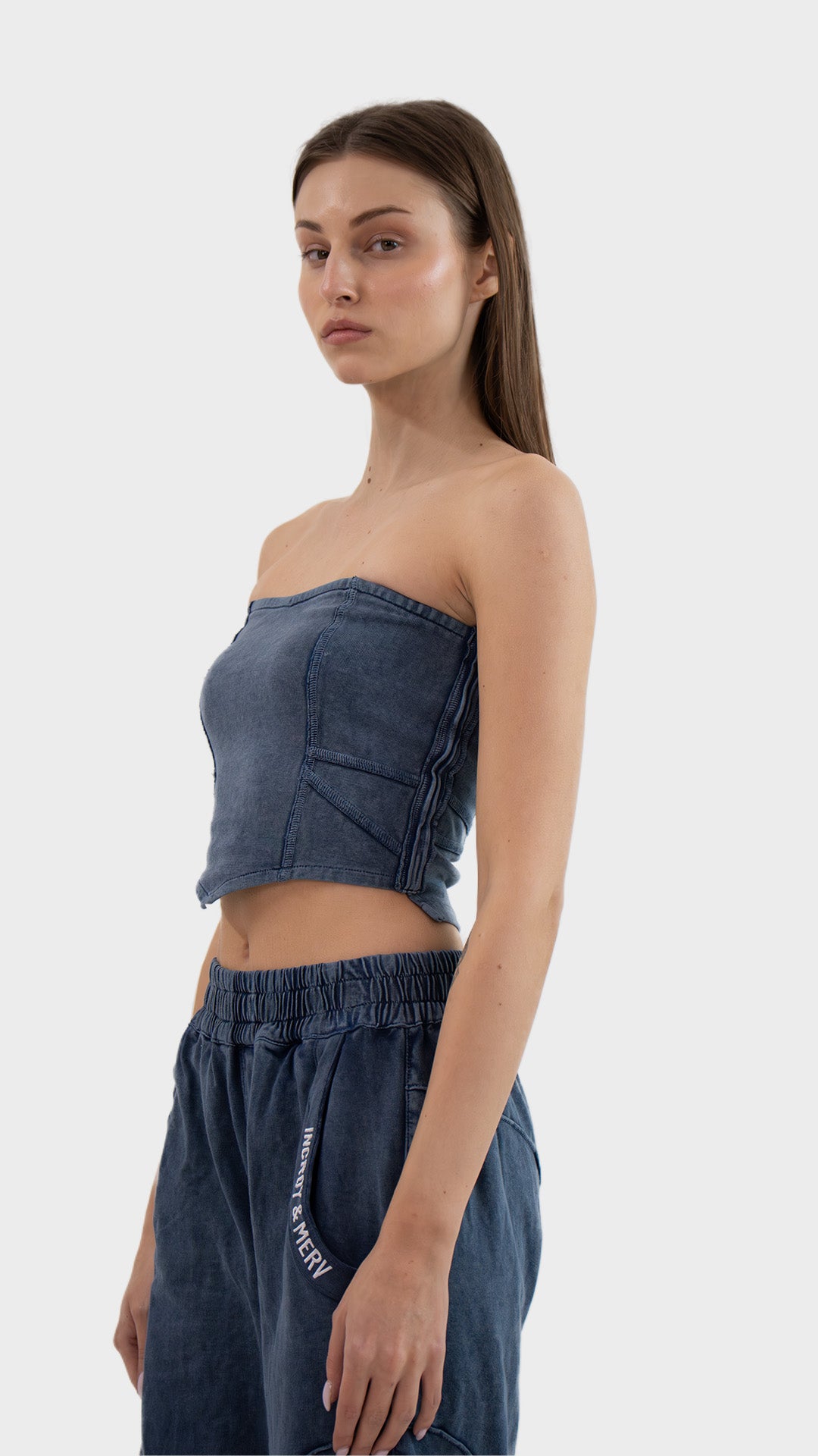 Side view highlighting the fitted silhouette and ribbed texture of the Incroy & Merv women's Beyond Tube Top.