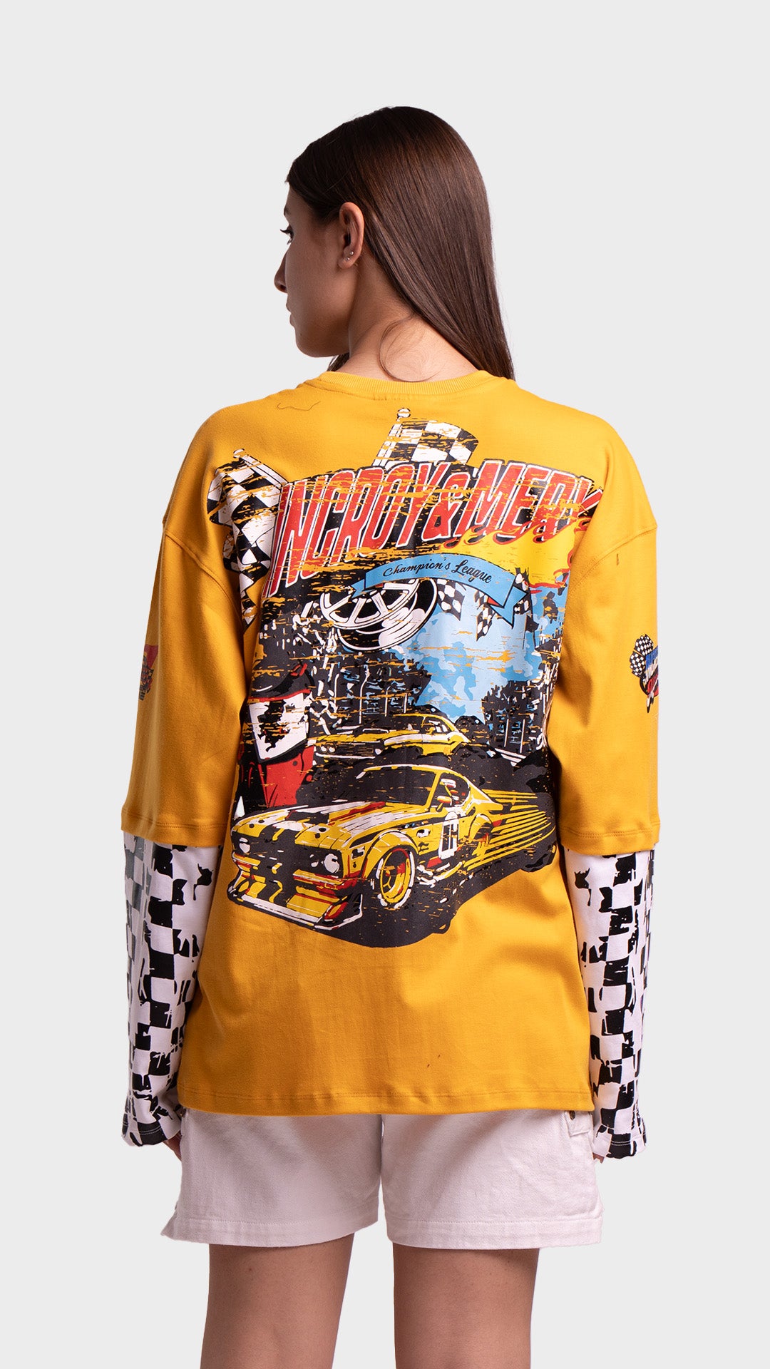 Yellow race car graphic on the back of an Incroy & Merv mustard yellow streetwear t-shirt.