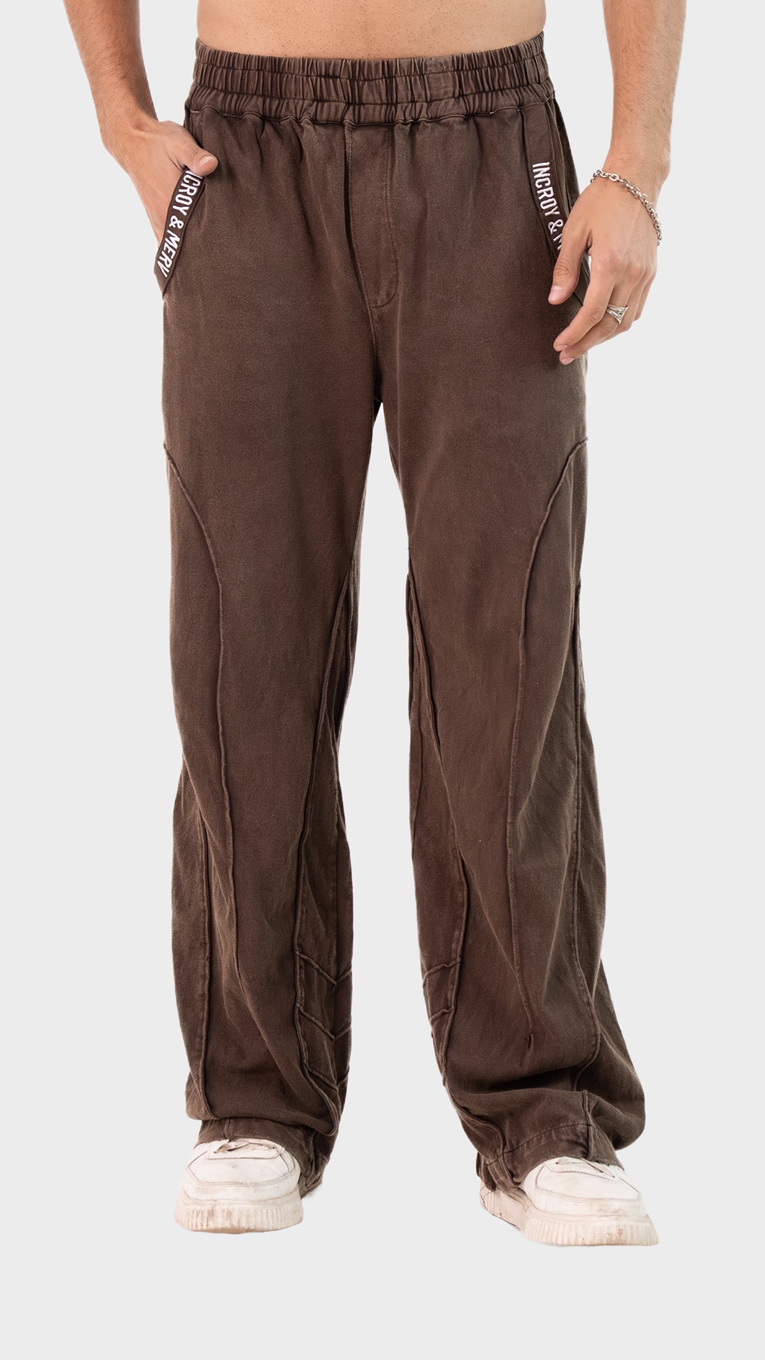 Men's brown cotton sinker trouser front view showing raw seam details.