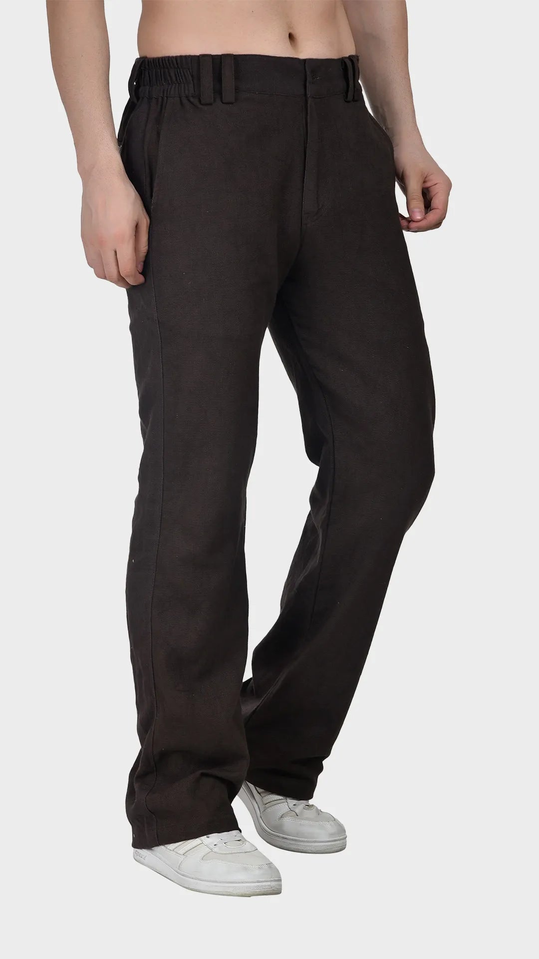 Three-quarter view of a male model wearing dark brown slub fabric pants.