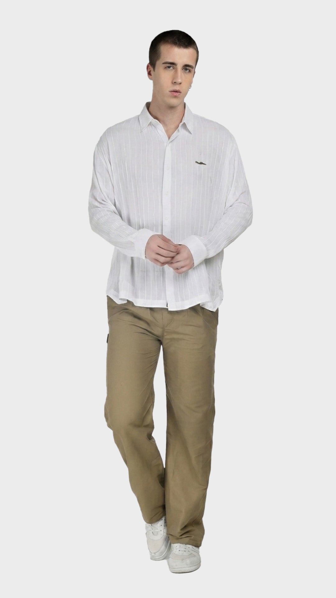 Full-body view of a model in a white rayon crepe shirt paired with khaki trousers.