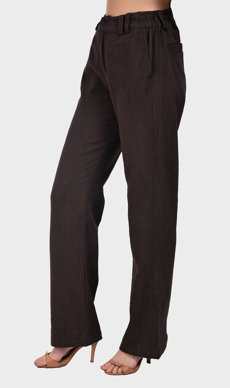 Side profile shot displaying the drape and fit of women's dark brown slub cotton trousers.