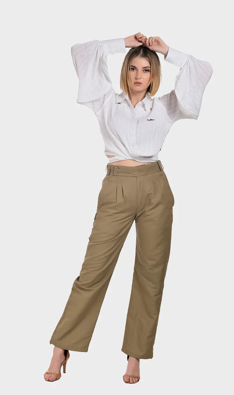 Full-body shot of a model styling a white rayon tie-waist balloon sleeve shirt with khaki tailored pants and heels.