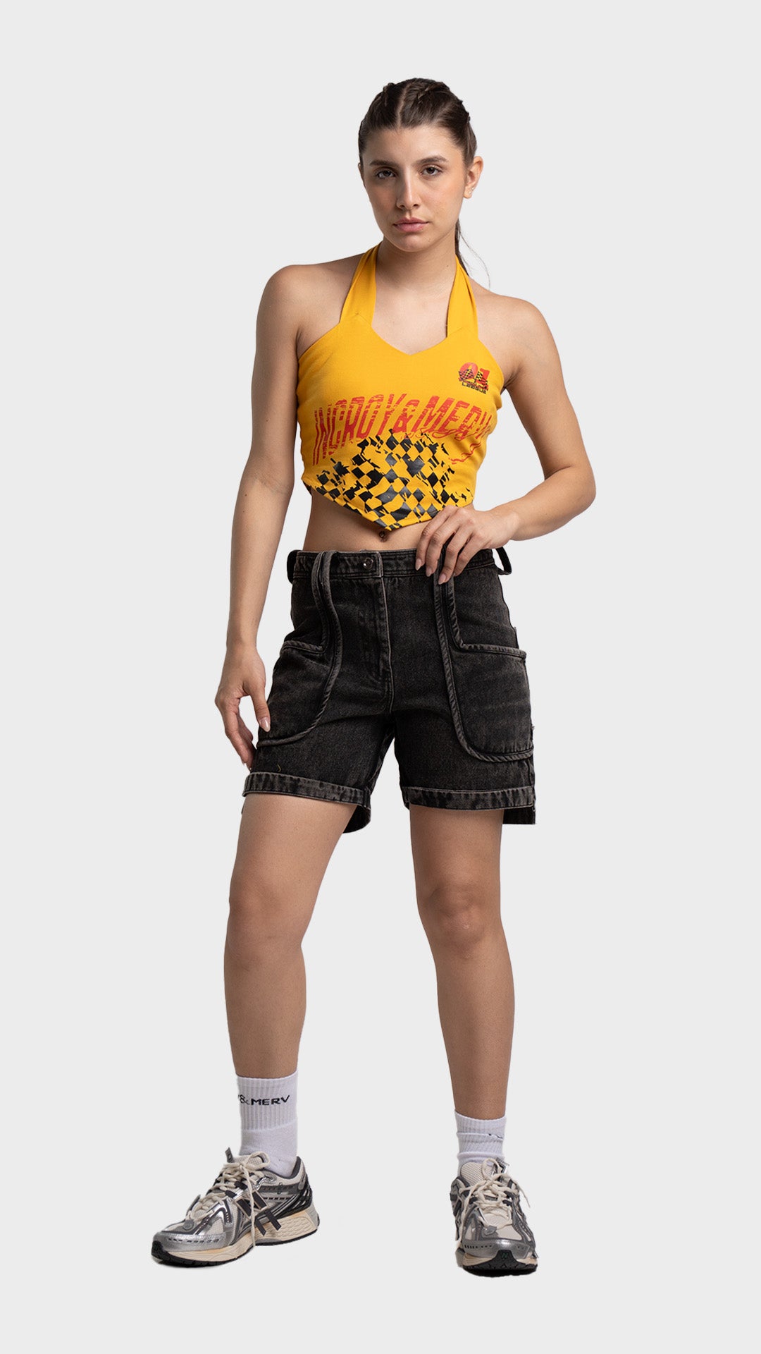 Full outfit look: yellow checkered halter crop top with denim shorts and sneakers.