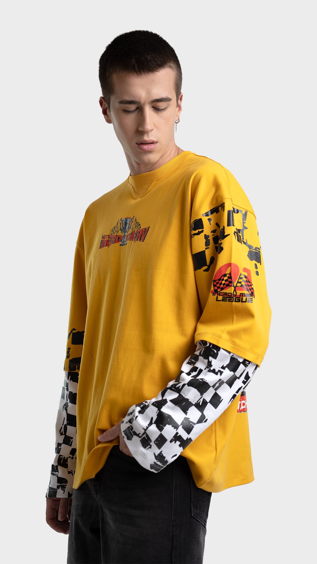 Yellow layered streetwear shirt with checkered sleeves. Incroy & Merv relaxed fit mediumweight summer tee showing graphic detailing across the arm.