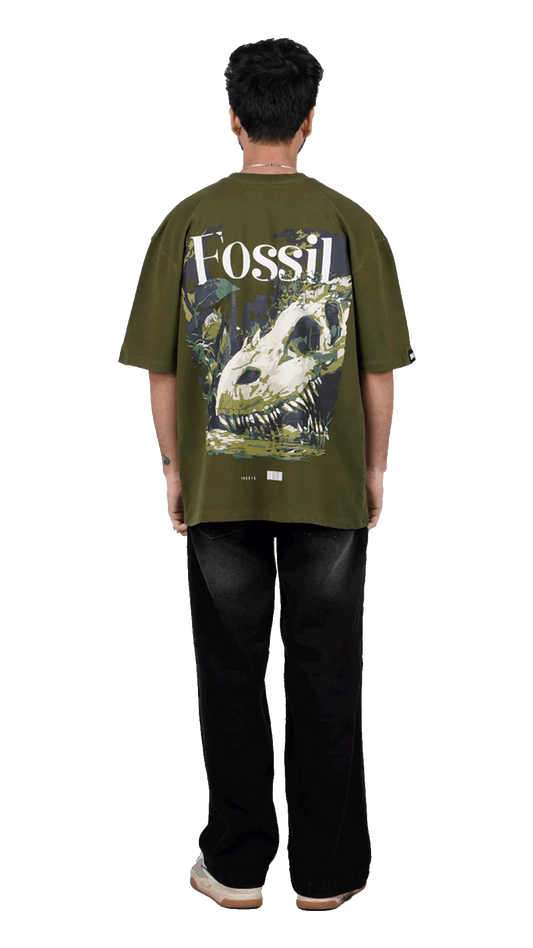 Olive green streetwear shirt featuring a large dinosaur fossil skull back print and white Fossil typography
