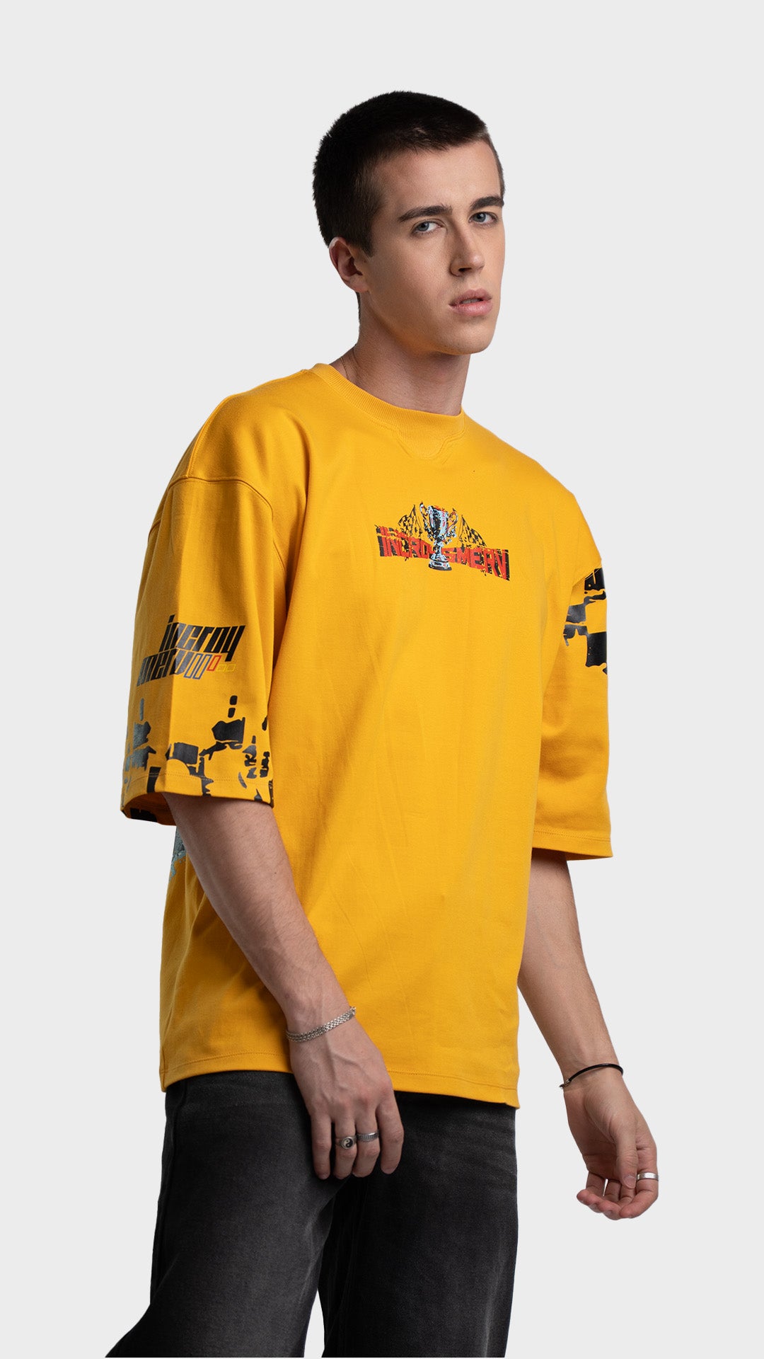 Mediumweight yellow streetwear 
t-shirt. Drop-shoulder oversized graphic tee showing checkered sleeve graphic.