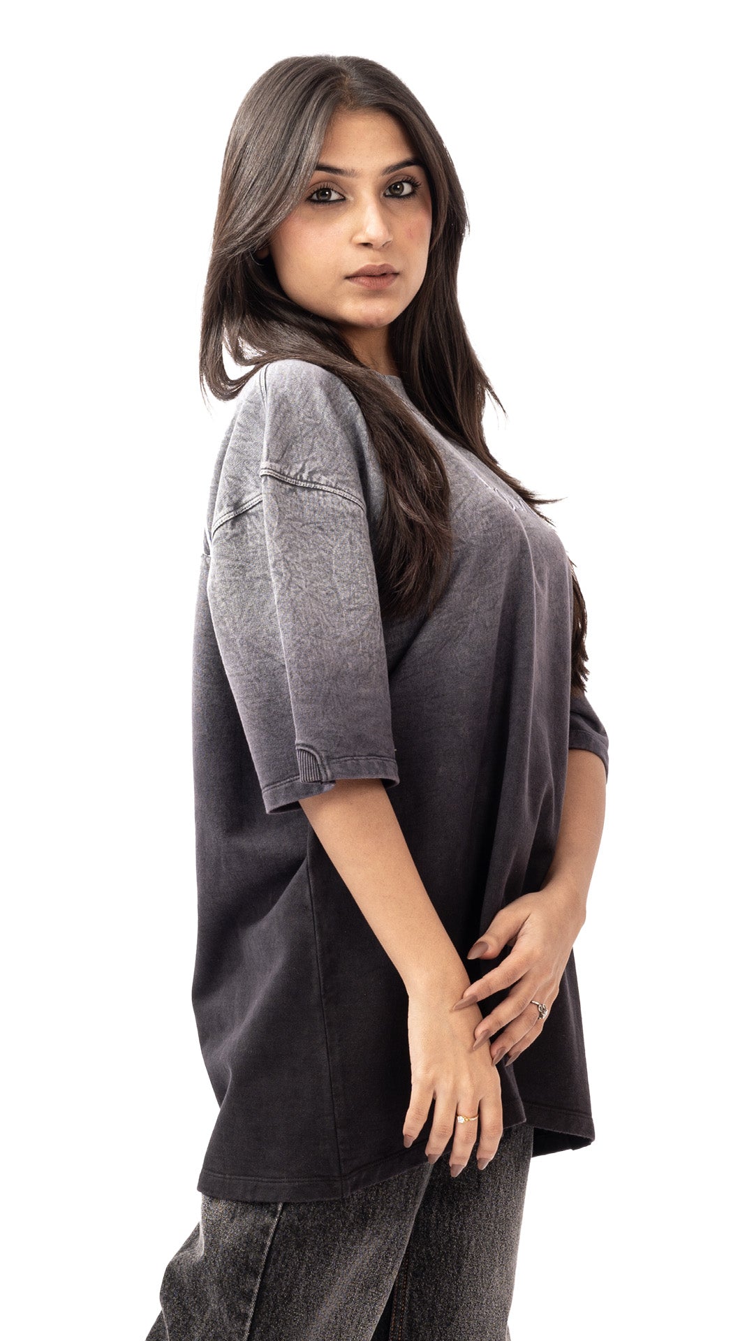 Three-quarter view showing the relaxed fit of a grey ombre streetwear t-shirt.