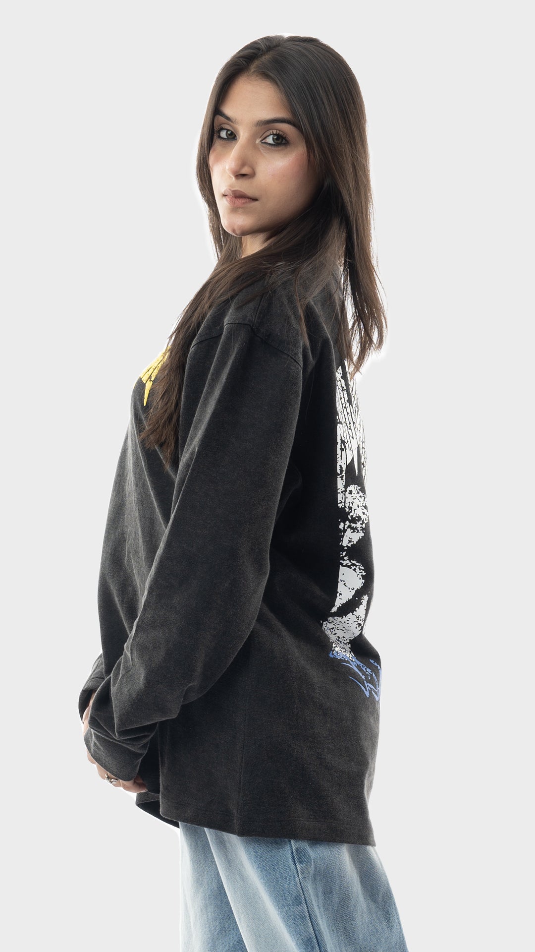 Profile shot of a dark charcoal vintage wash oversized pullover sweatshirt.