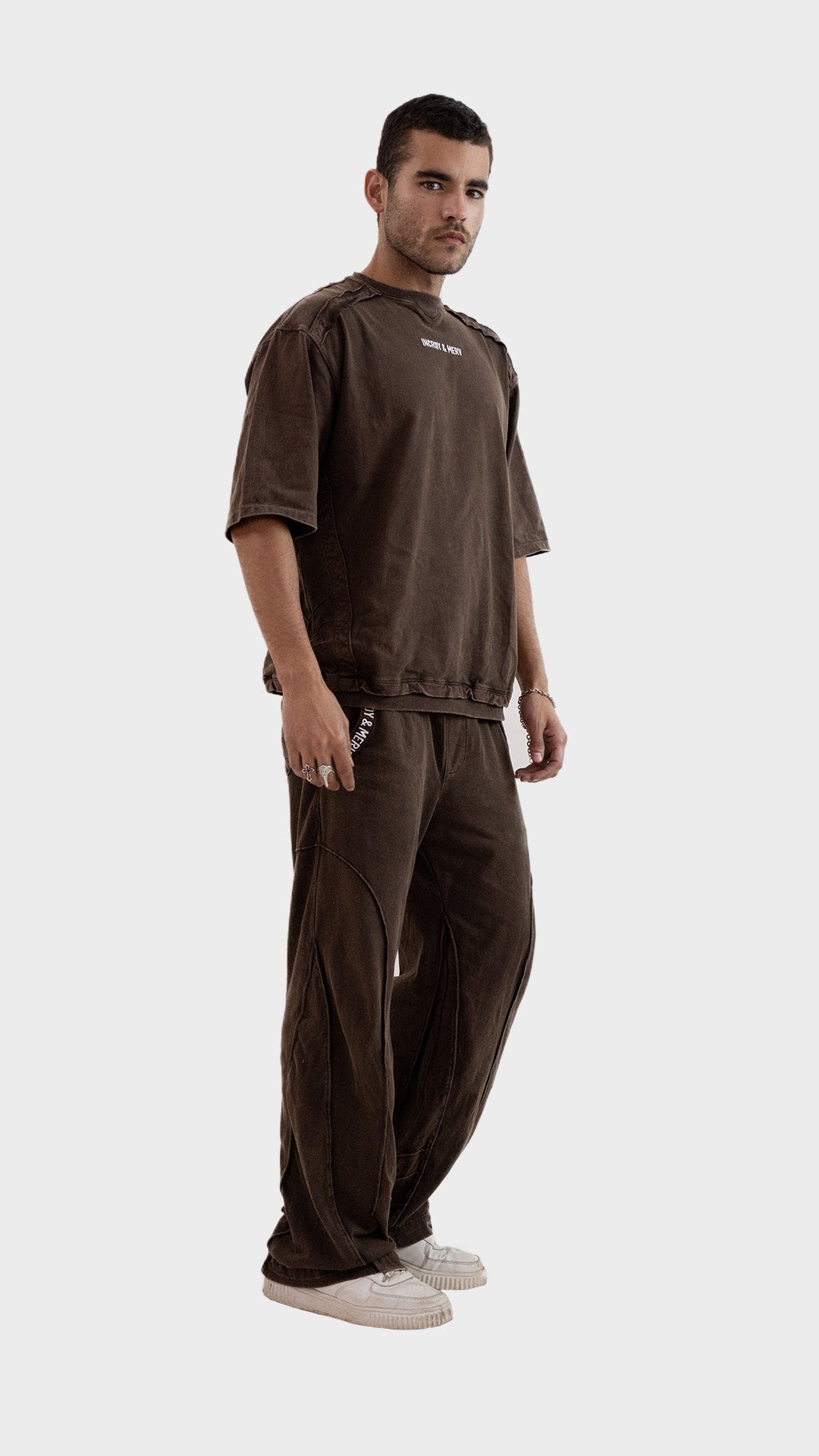 Three quarter angle view of a male model wearing the Incroy and Merv Brown Beyond Co-Ord Set.