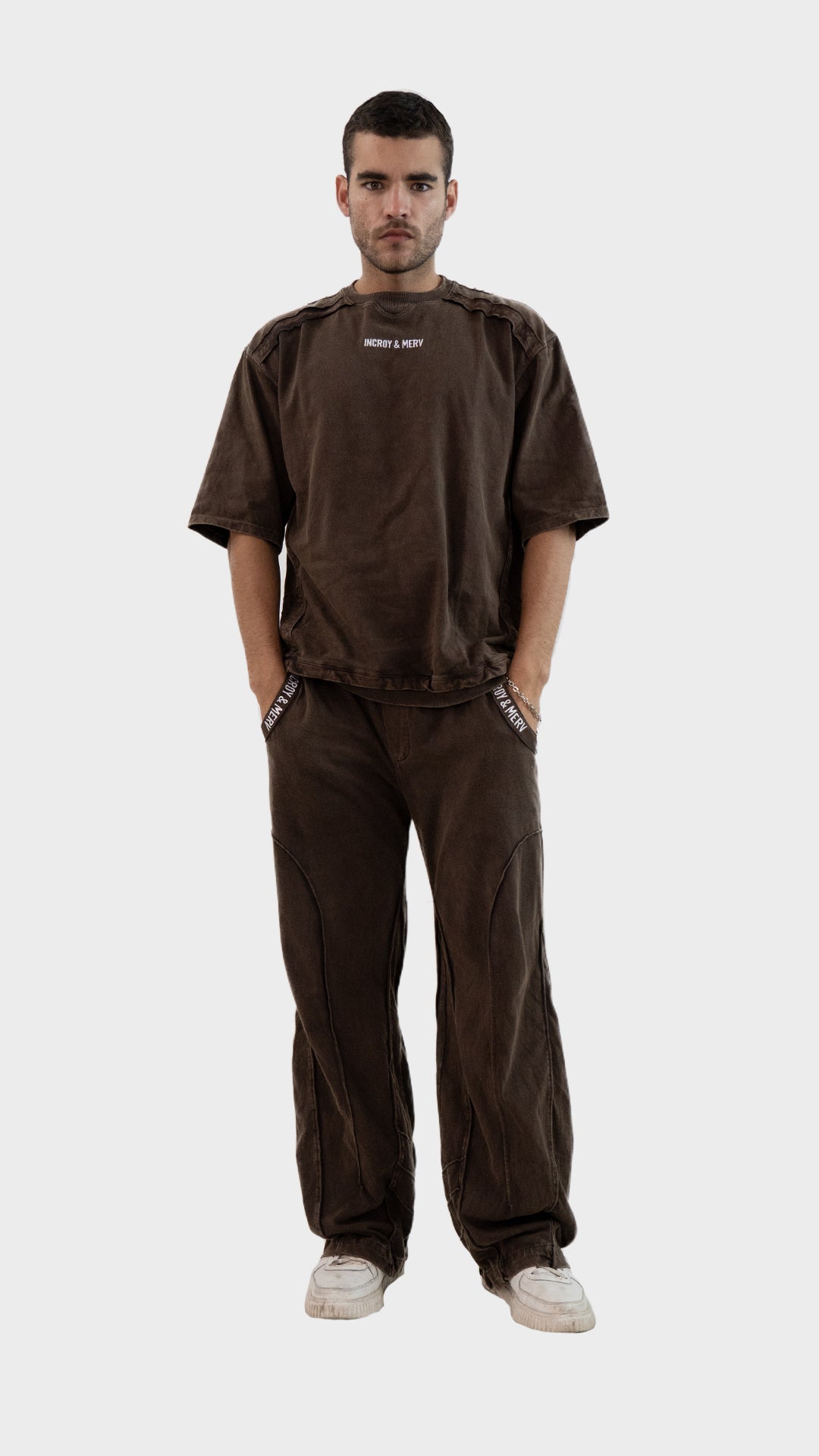 Front view of a man wearing the Incroy and Merv Beyond Co-Ord Set in Brown featuring an oversized t-shirt and matching trousers.