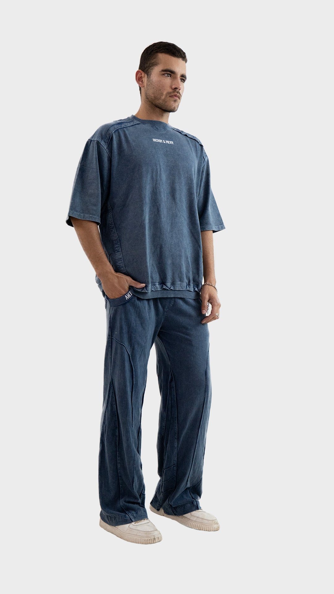 Three quarter angle view of a male model wearing the Incroy and Merv Dusky Blue Beyond Co-Ord Set.