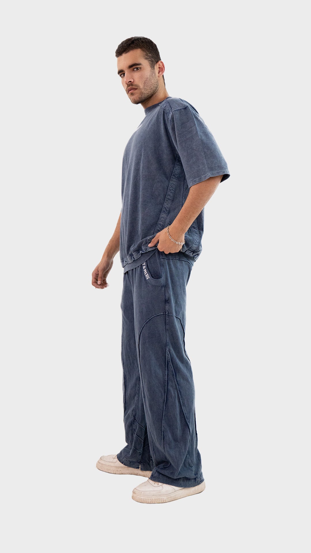 Side profile view of the Incroy and Merv Beyond Co-Ord Set in Dusky Blue highlighting the relaxed streetwear fit.