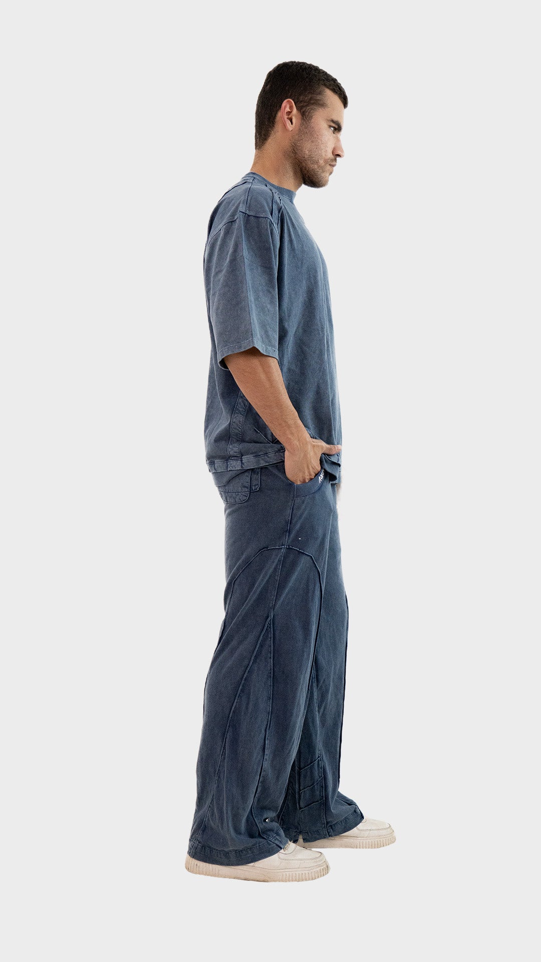 Full length side view of the Incroy and Merv Beyond Co-Ord Set in Dusky Blue made from sinker cotton fabric.
