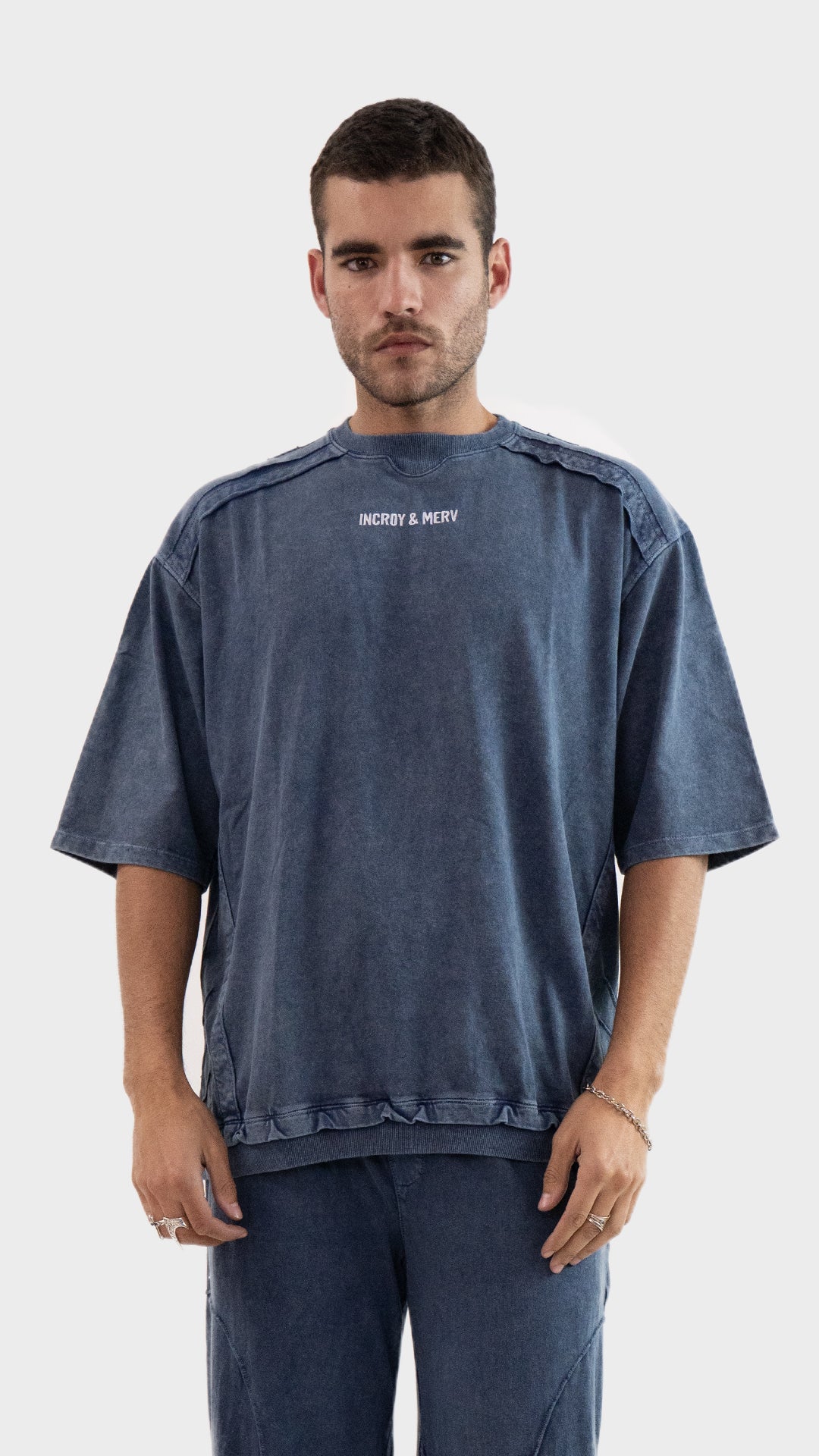 Incroy and Merv Beyond T-Shirt in Dusky Blue featuring an oversized fit, chest logo detailing, and sinker cotton fabric.