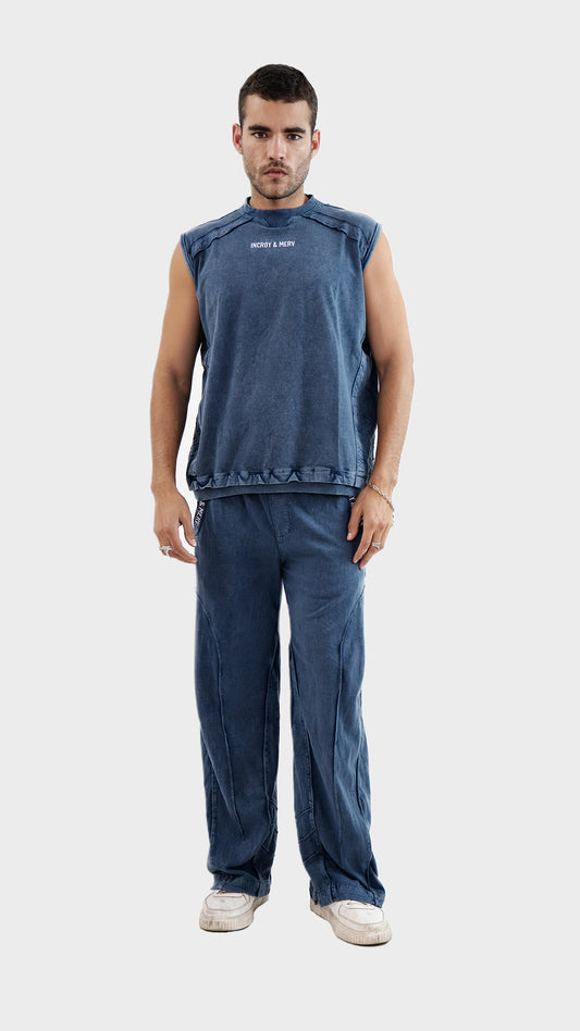 Front view of a man wearing the Incroy and Merv Beyond Tank Top Co-Ord Set in Dusky Blue with matching trousers.