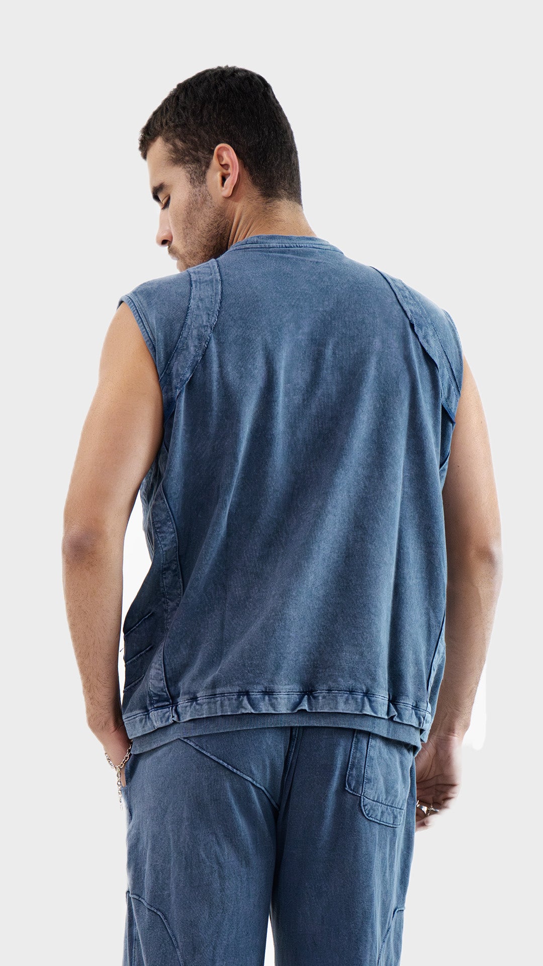 Back view of the Incroy and Merv Dusky Blue Beyond Tank Top showing vintage wash finish and ribbed hem detailing.
