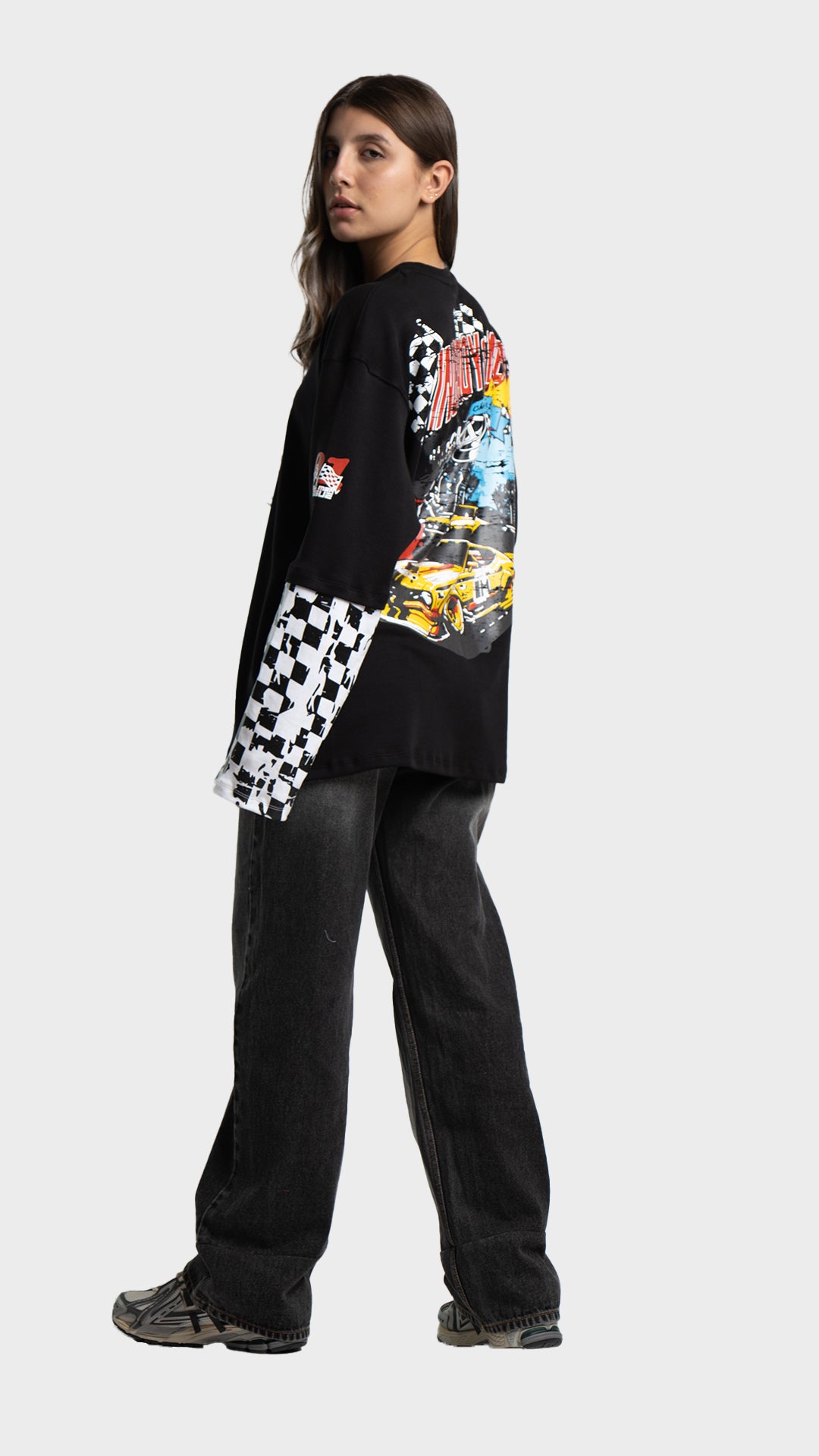 Full body back view of an Incroy & Merv black oversized streetwear t-shirt paired with baggy jeans.