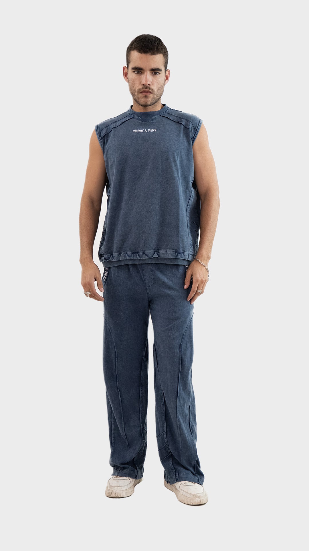 Full length front view of a male model wearing Incroy & Merv men's dusky blue Beyond Trouser in cotton sinker fabric.