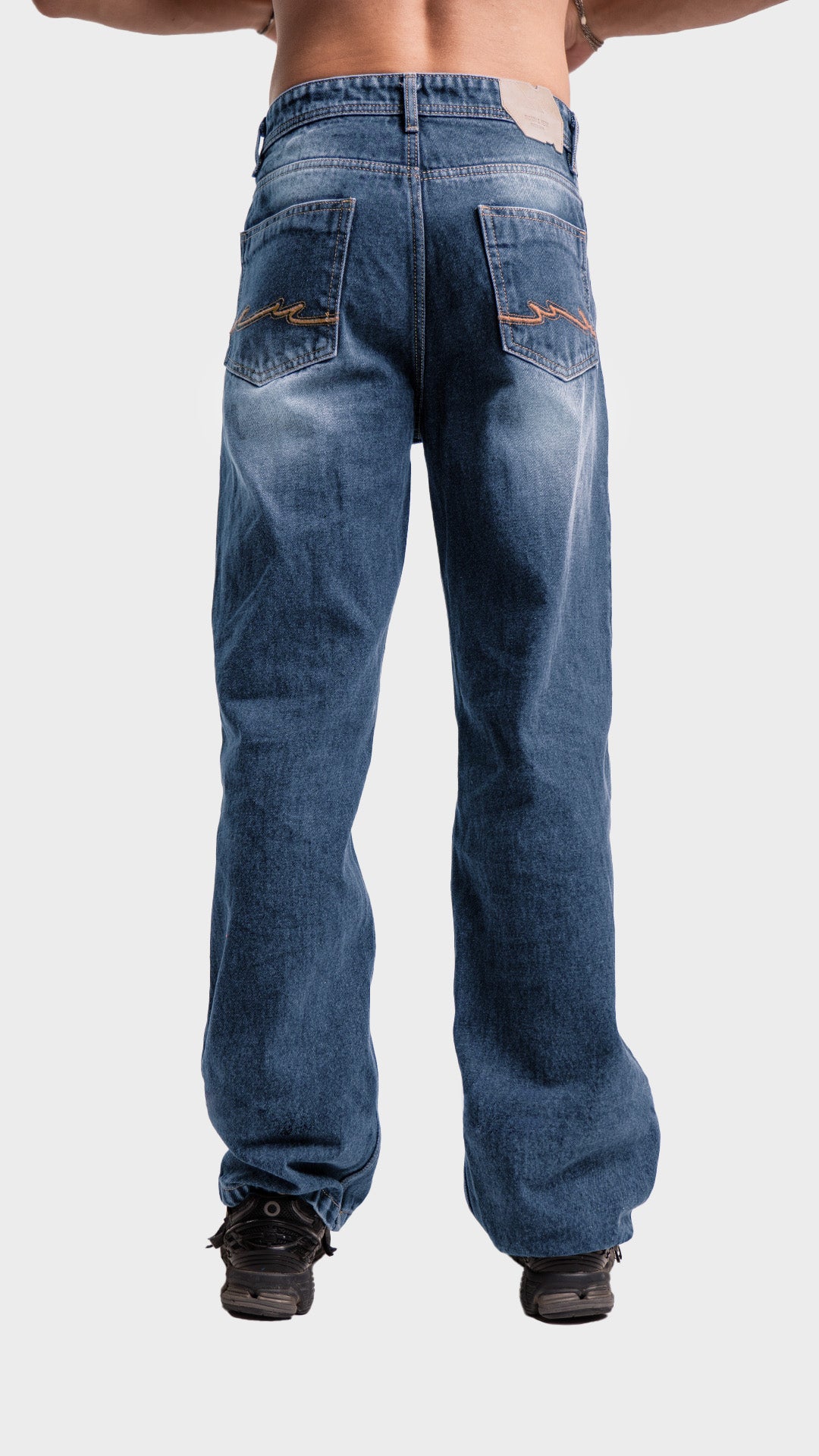 Back pockets and fit view of men's wide leg denim jeans by Incroy & Merv.