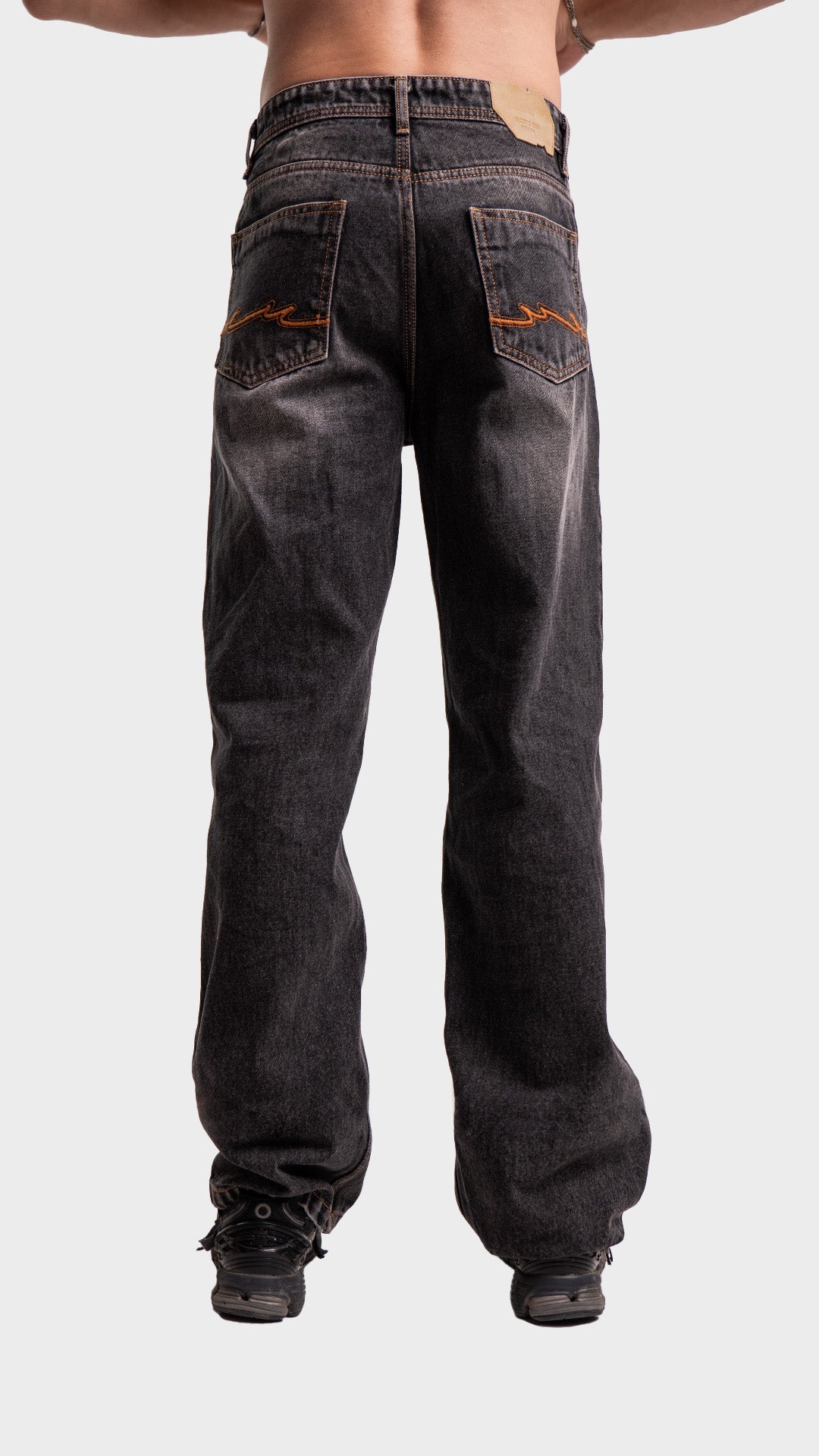 Back pockets and fit view of men's wide leg smoked grey denim jeans by Incroy & Merv.