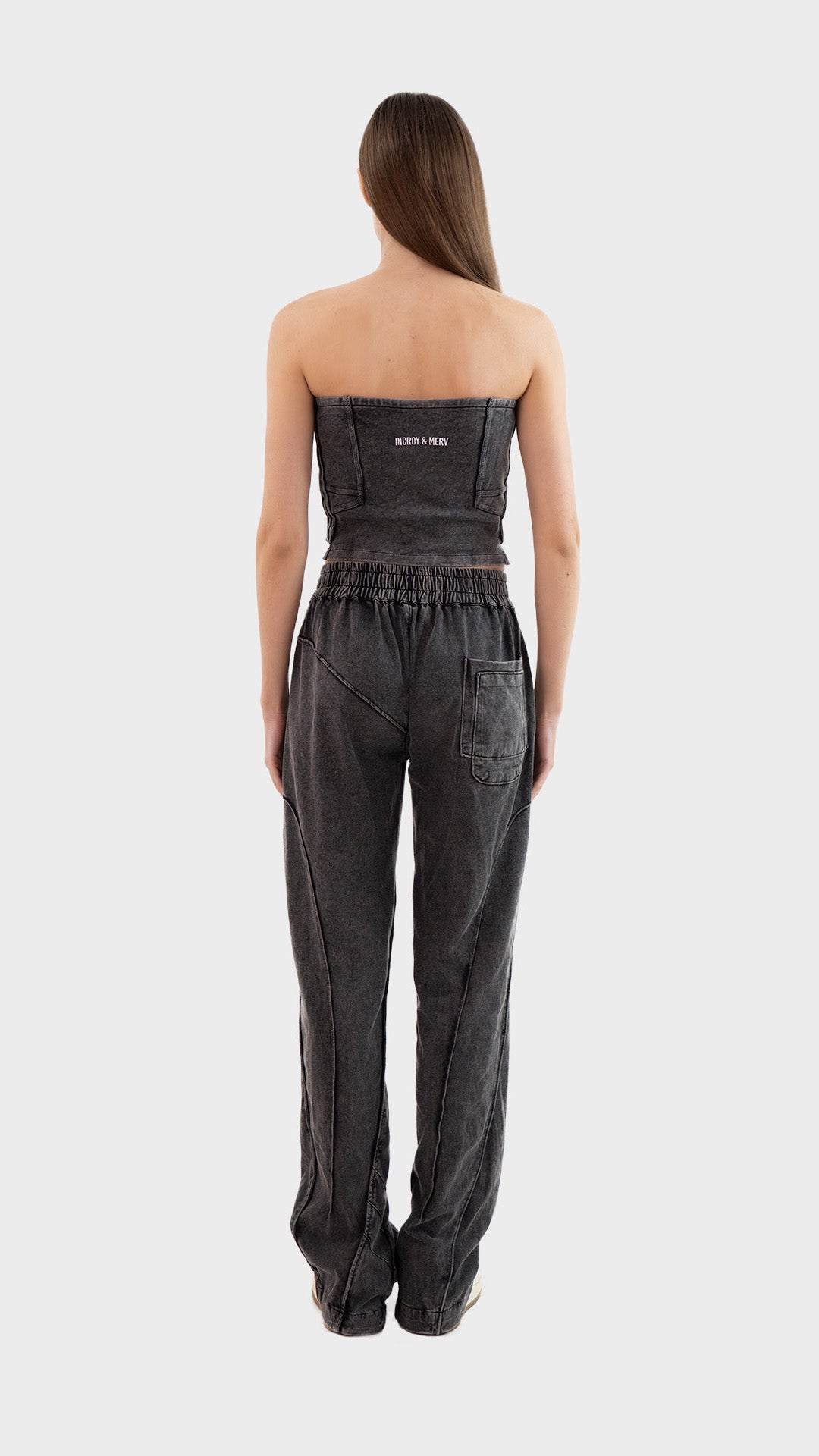 Full length back view of Incroy & Merv women's Beyond Co-Ord Set in washed charcoal showing rear seam details and embroidery.