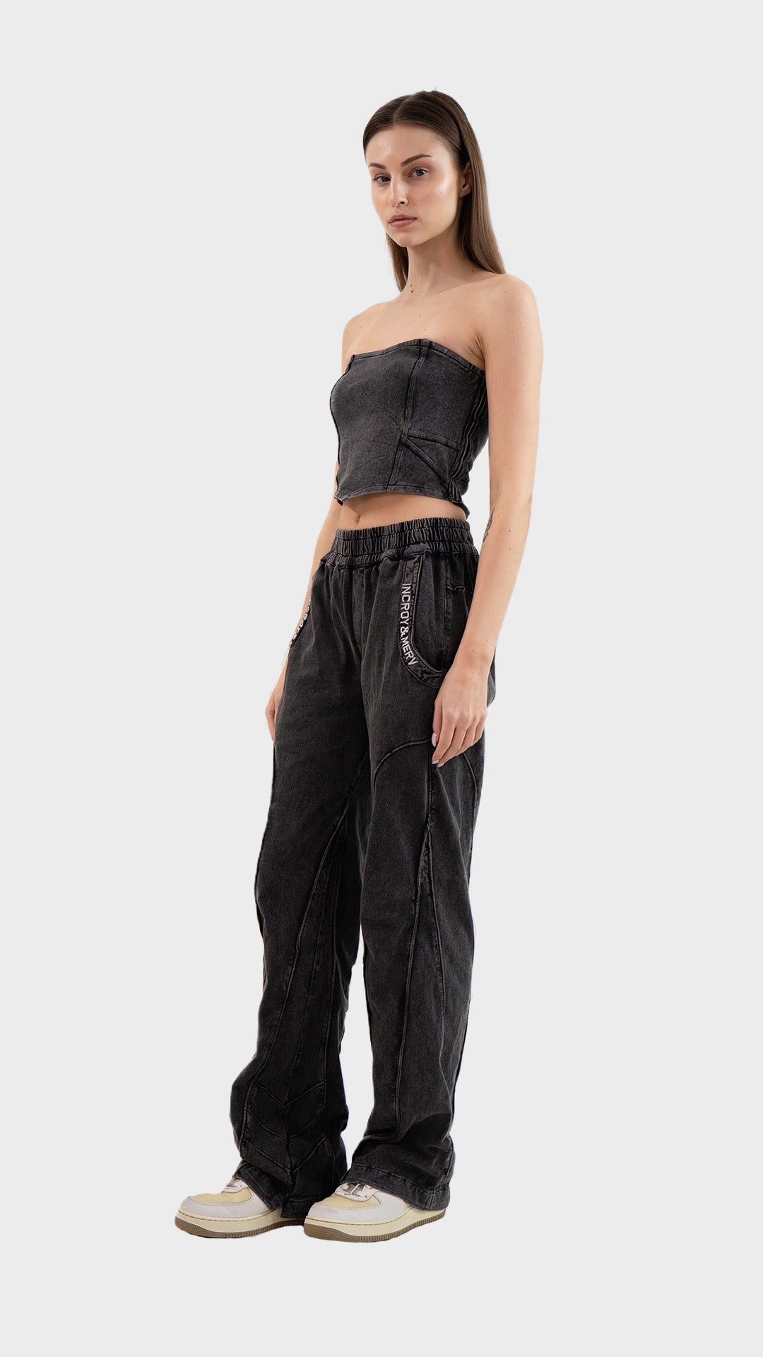 Three-quarter front view of a model posing in the Incroy & Merv women's charcoal ribbed Beyond Co-Ord Set.