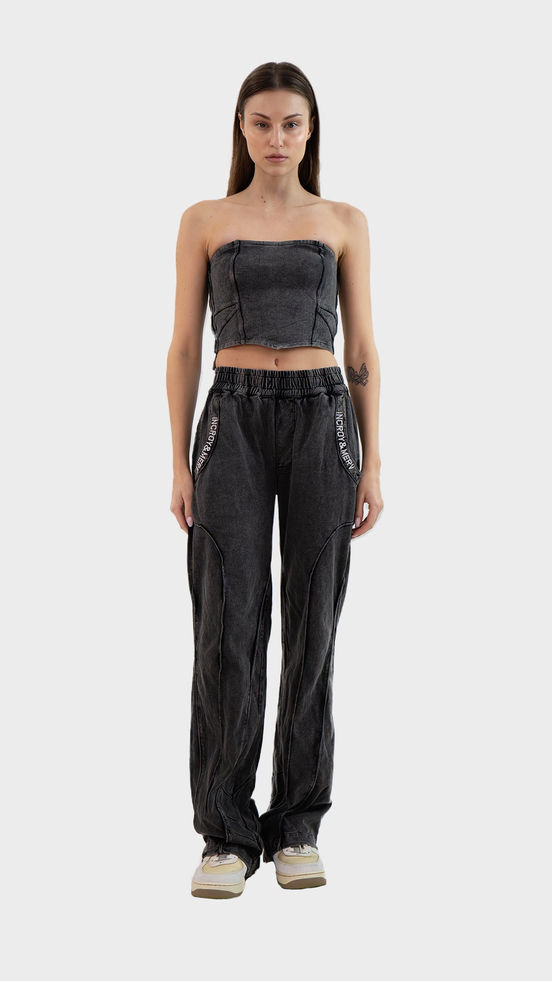 Full length front view of Incroy & Merv women's Beyond Co-Ord Set in washed charcoal ribbed fabric with tube top and straight leg pants.