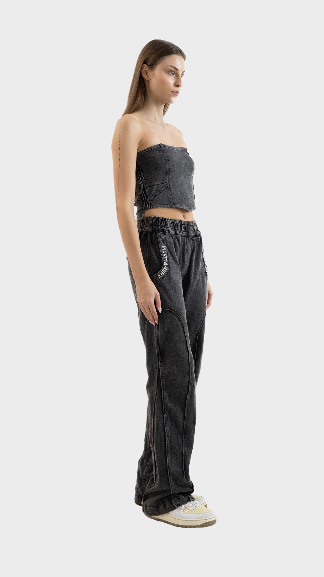 Side profile view showing the fit and seam details of the Incroy & Merv women's washed charcoal ribbed Beyond Co-Ord Set.