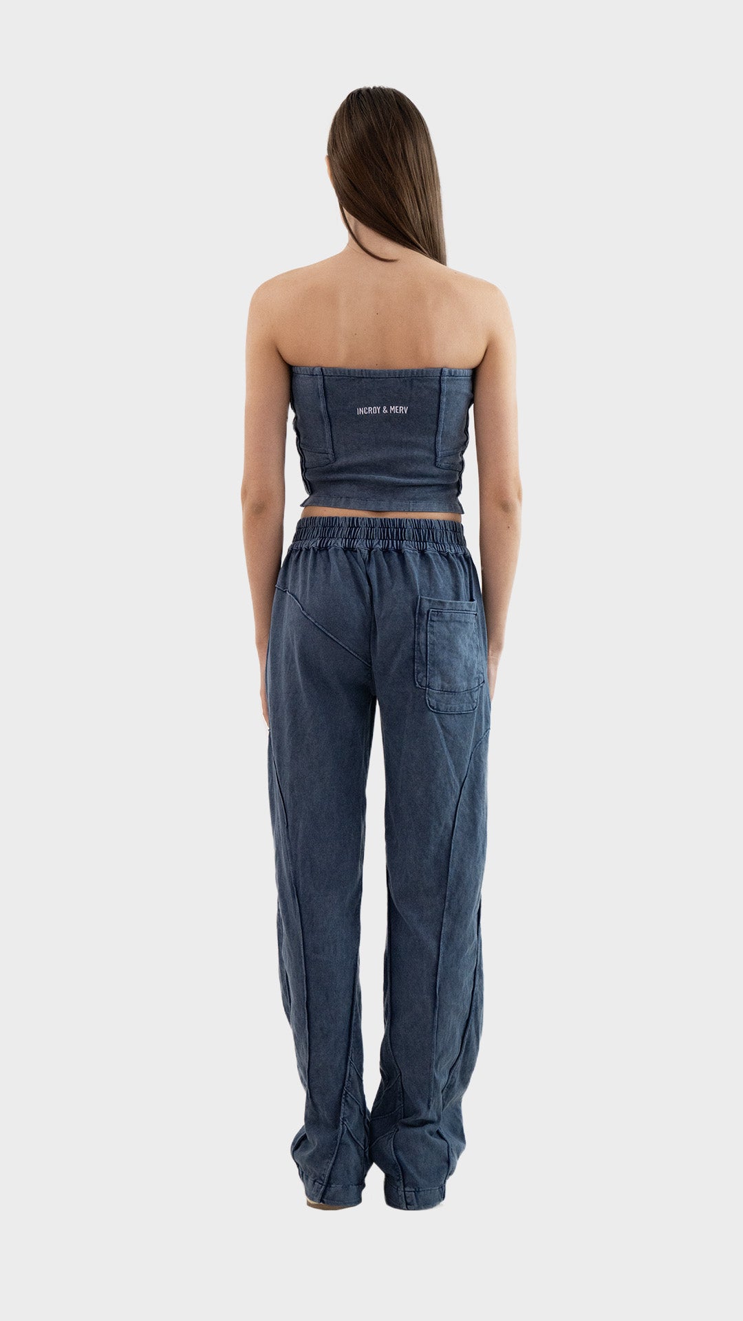 Full length back view of Incroy & Merv women's Beyond Co-Ord Set in dusky blue showing rear seam details and embroidery.