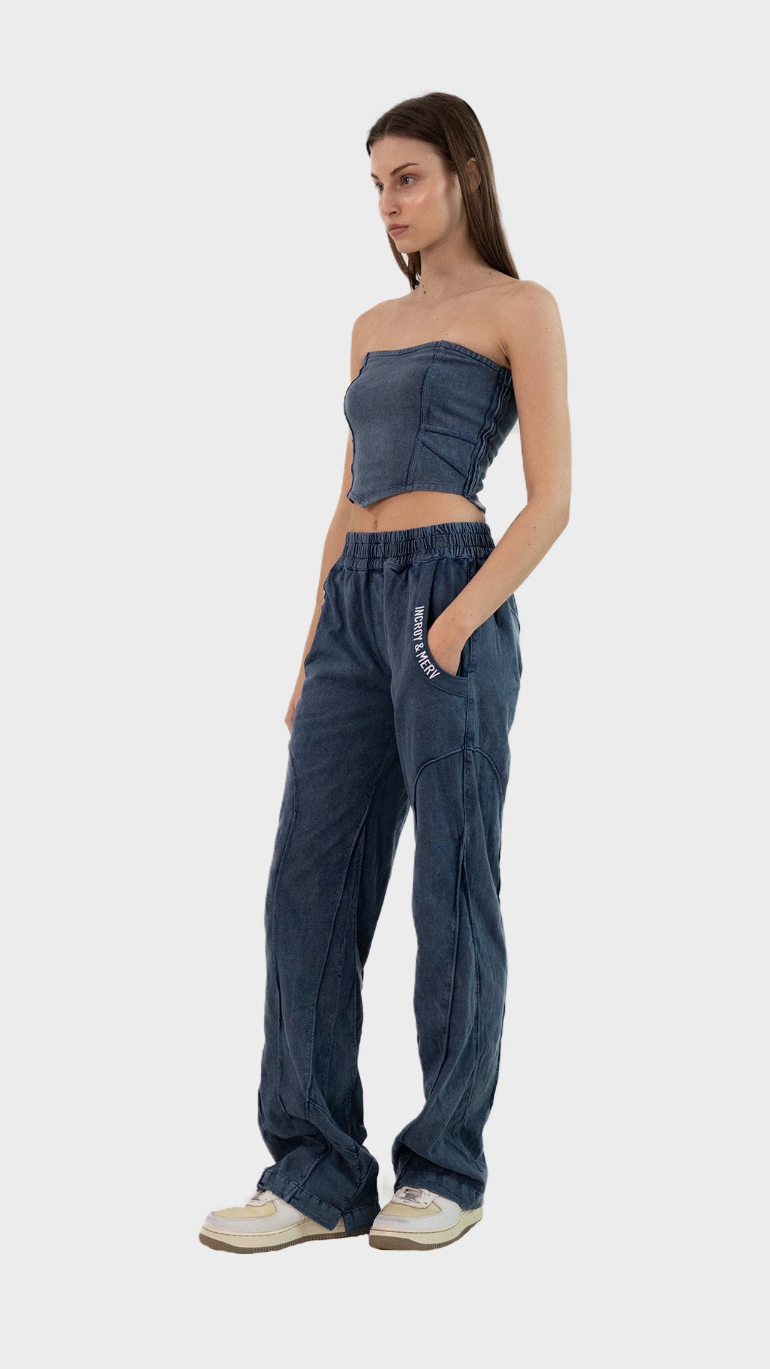 Three-quarter front view of a model posing in the Incroy & Merv women's dusky blue ribbed Beyond Co-Ord Set.