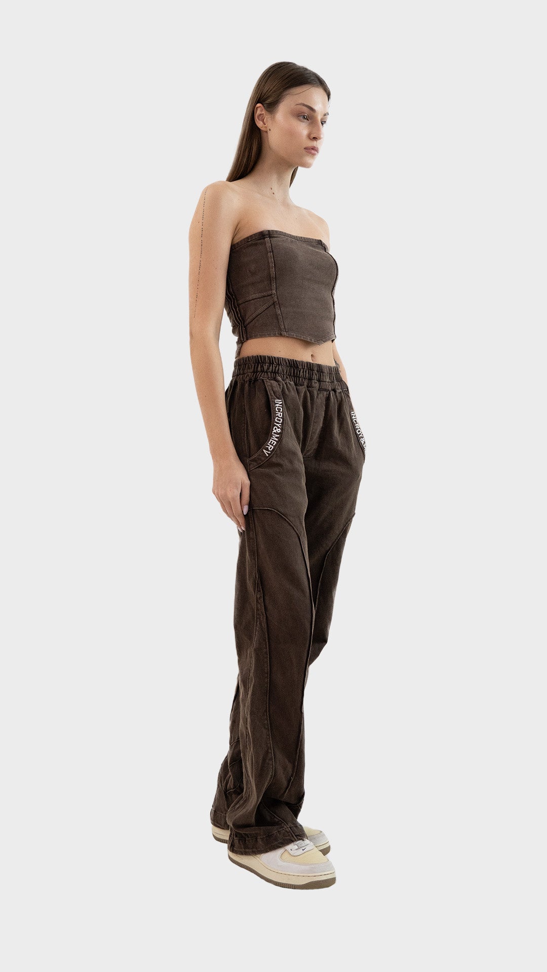 Three-quarter front angle view of a model in the Incroy & Merv women's Beyond Co-Ord Set in washed brown ribbed fabric.