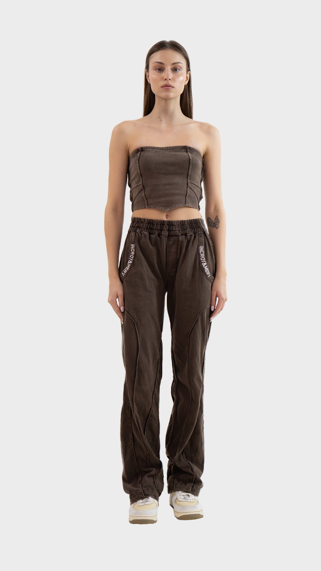 Full length front view of Incroy & Merv women's Beyond Co-Ord Set in washed brown ribbed fabric with tube top and straight leg track pants.