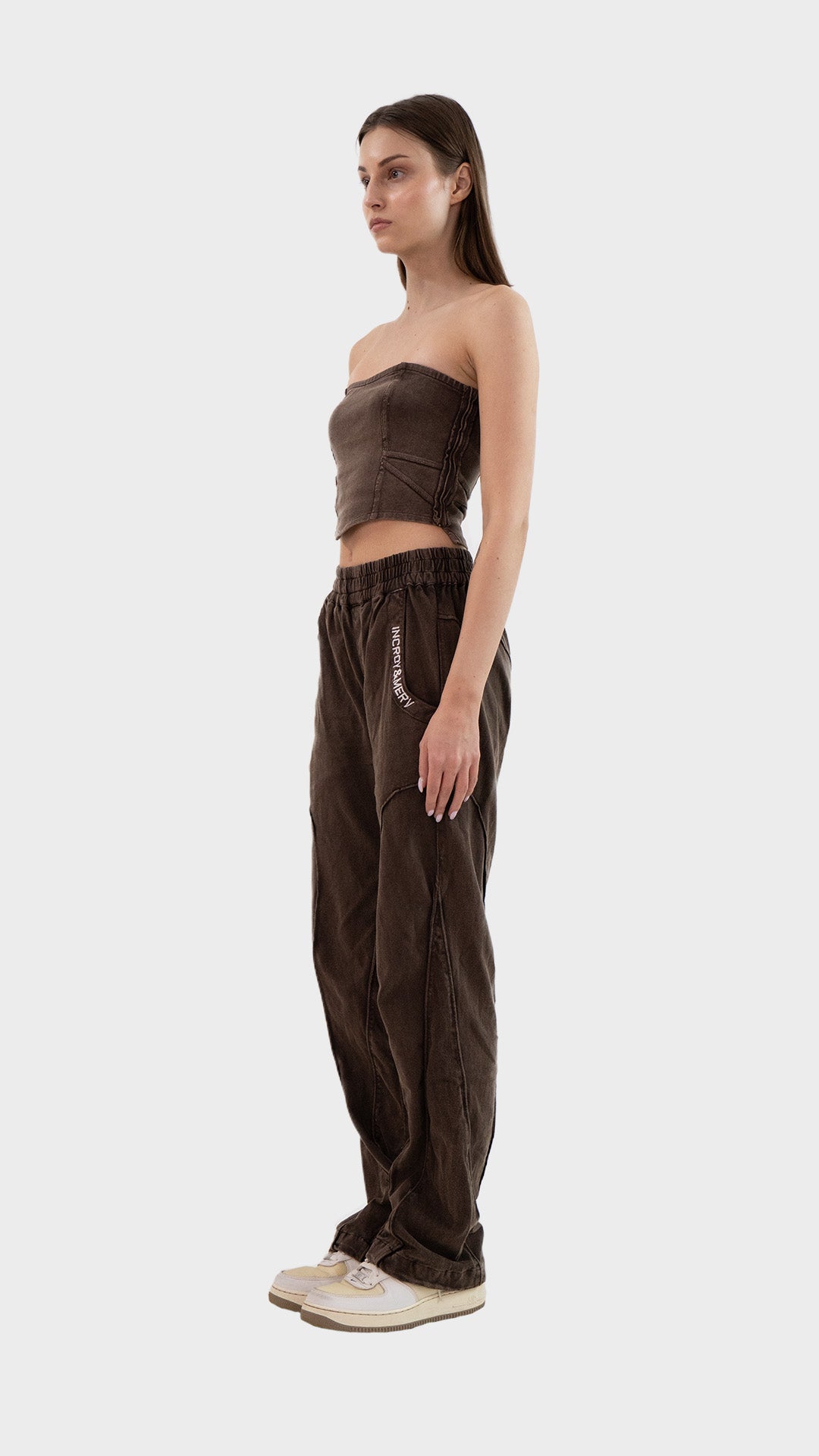 Side profile view showing the fit and seam details of the Incroy & Merv women's washed brown ribbed Beyond Co-Ord Set.