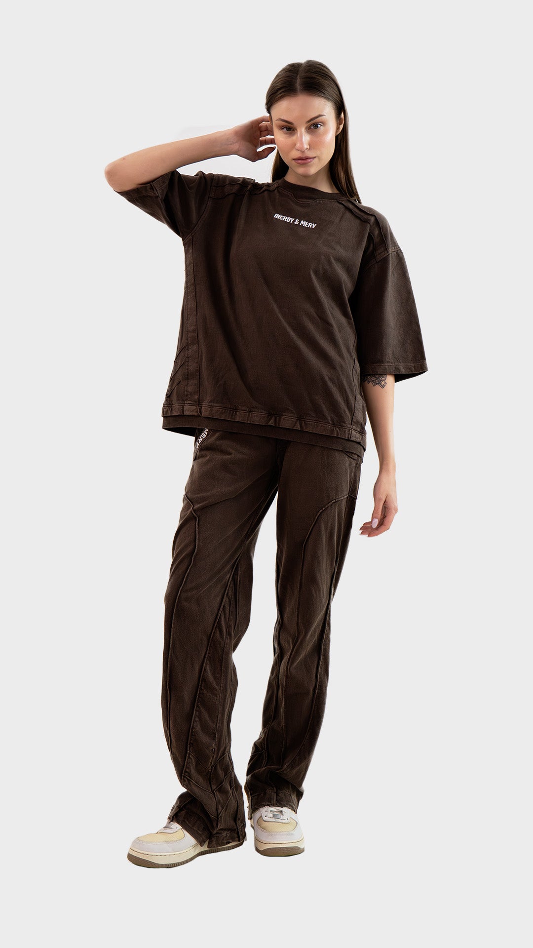 Three-quarter front view of female model wearing Incroy & Merv women's brown Beyond Lower co-ord set.