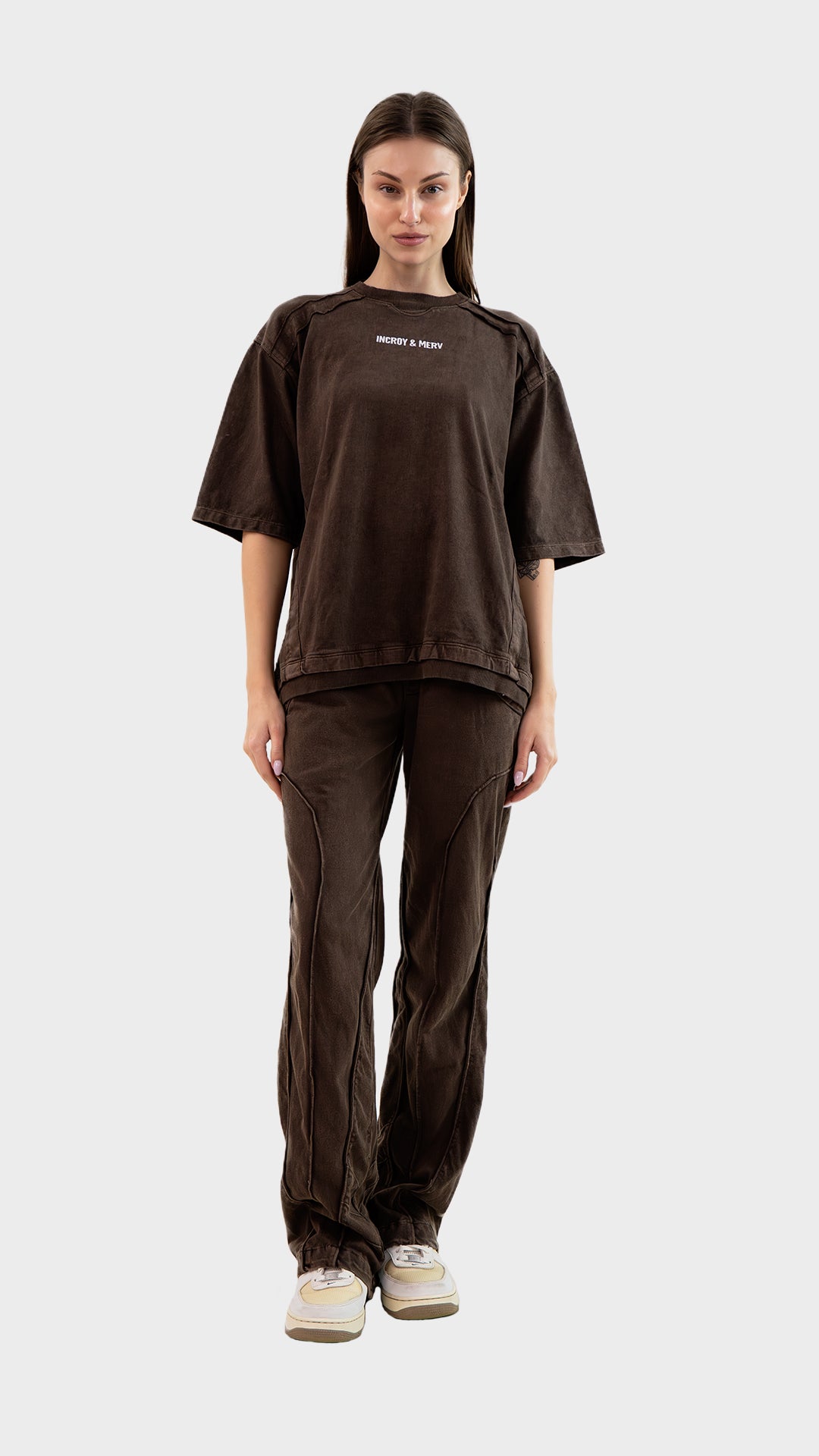 Full length front view of female model wearing Incroy & Merv women's brown Beyond Lower in cotton sinker fabric.