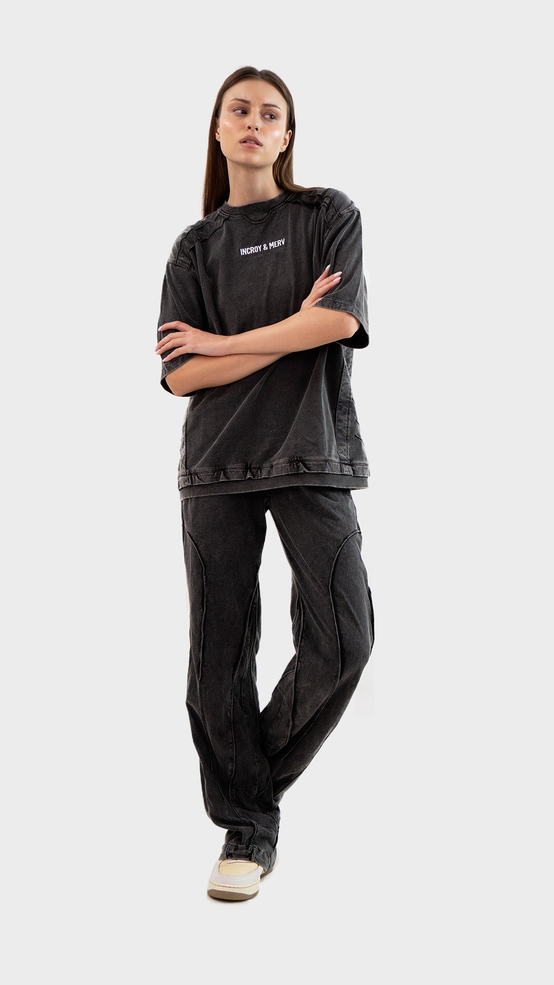 Three-quarter front view of Incroy & Merv women's charcoal Beyond Lower co-ord set in washed cotton sinker fabric.