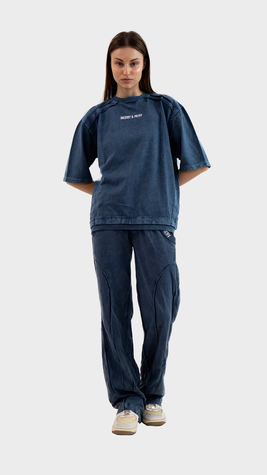 Full length front view of female model wearing Incroy & Merv women's dusky blue Beyond Lower in cotton sinker fabric.