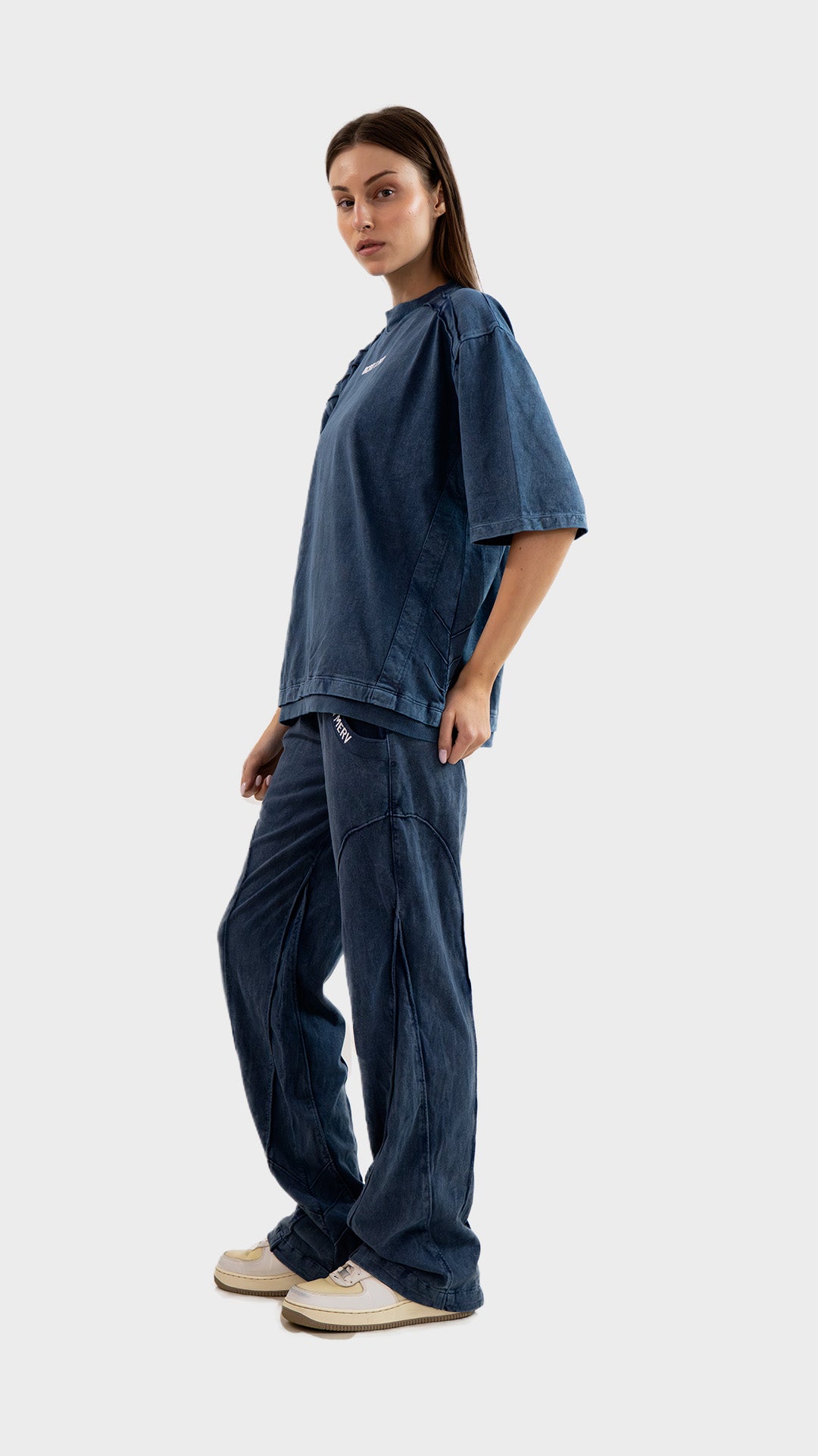 Three-quarter side view of Incroy & Merv women's dusky blue cotton sinker lower and co-ord set.
