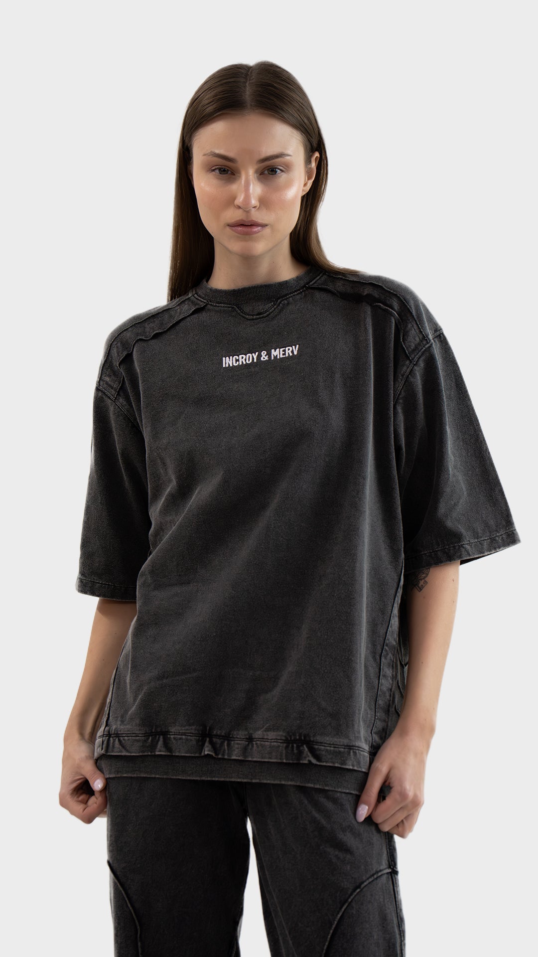 Front view of Incroy & Merv women's Beyond T-Shirt in washed charcoal cotton sinker fabric with embroidered logo detail.