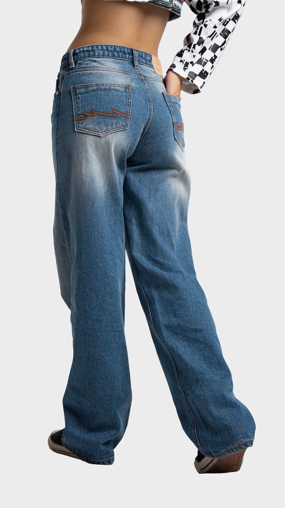Three-quarter back angle view highlighting pocket detailing on women's wide leg nitro blue denim jeans by Incroy & Merv.