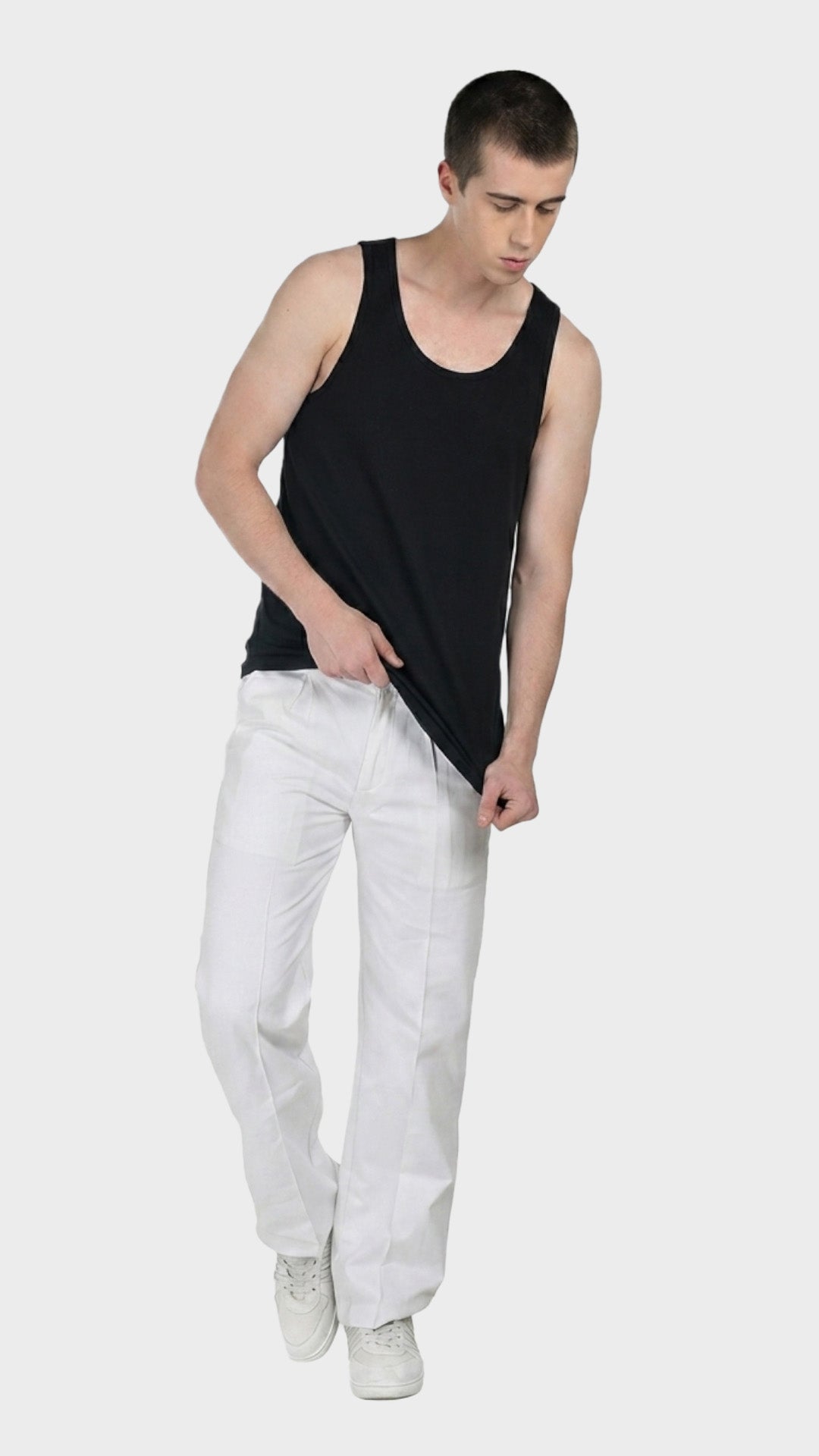 Full-body view of a male model posing in a black parker fabric vest.