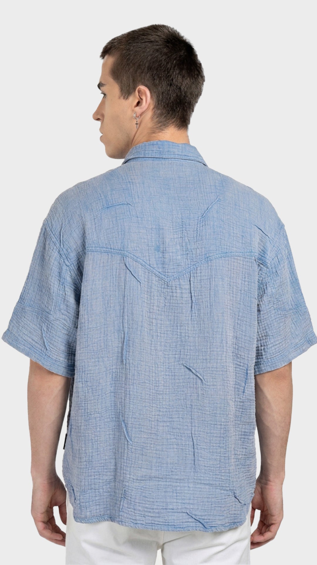 Direct back view showing the textured weave of a men's blue double cloth cotton shirt.
